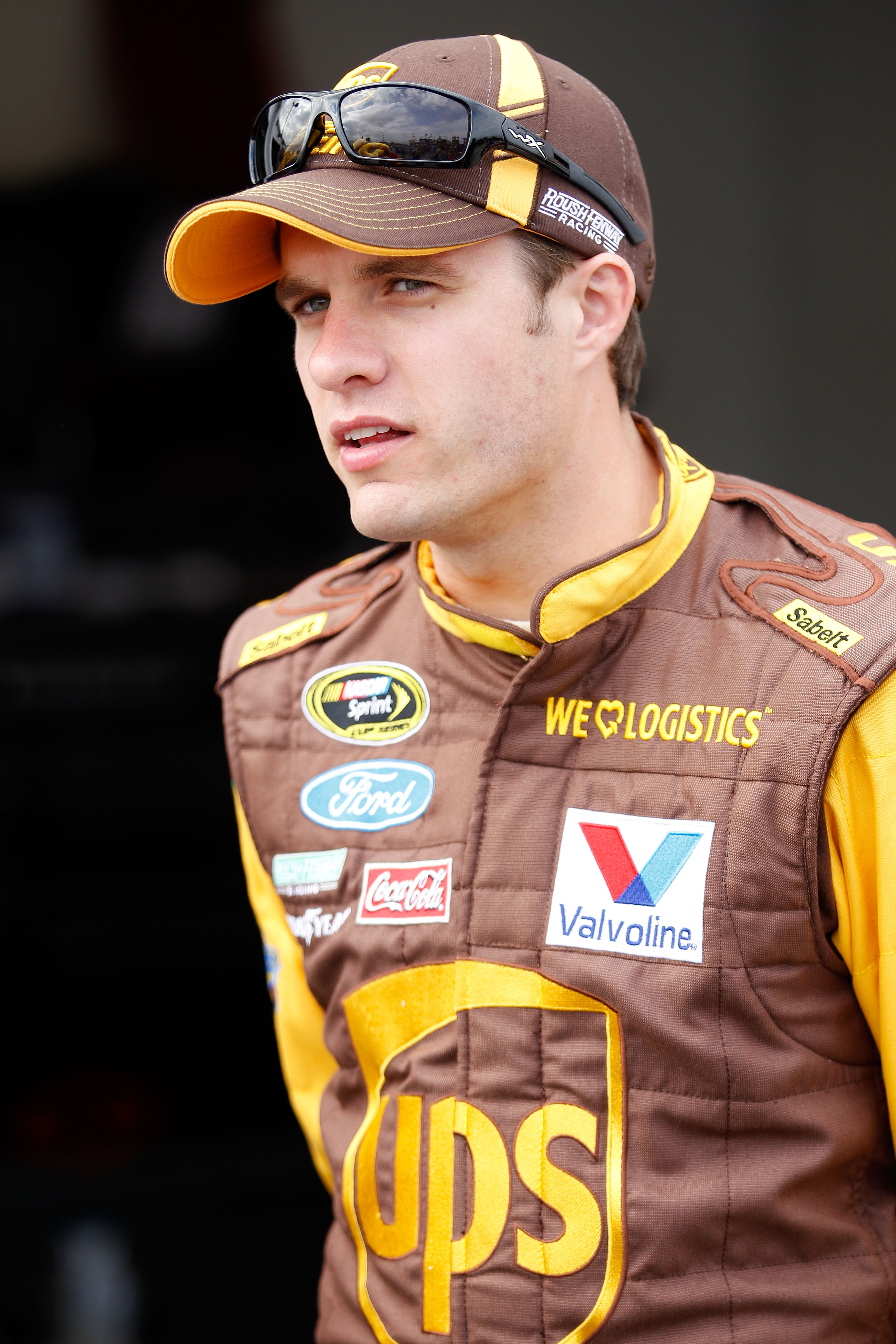 DAYTONA BEACH, FL - FEBRUARY 16:  David Ragan, driver of the #6 UPS Ford, looks on in the garage area during practice for the NASCAR Sprint Cup Series Daytona 500 at Daytona International Speedway on February 16, 2011 in Daytona Beach, Florida.  (Photo by