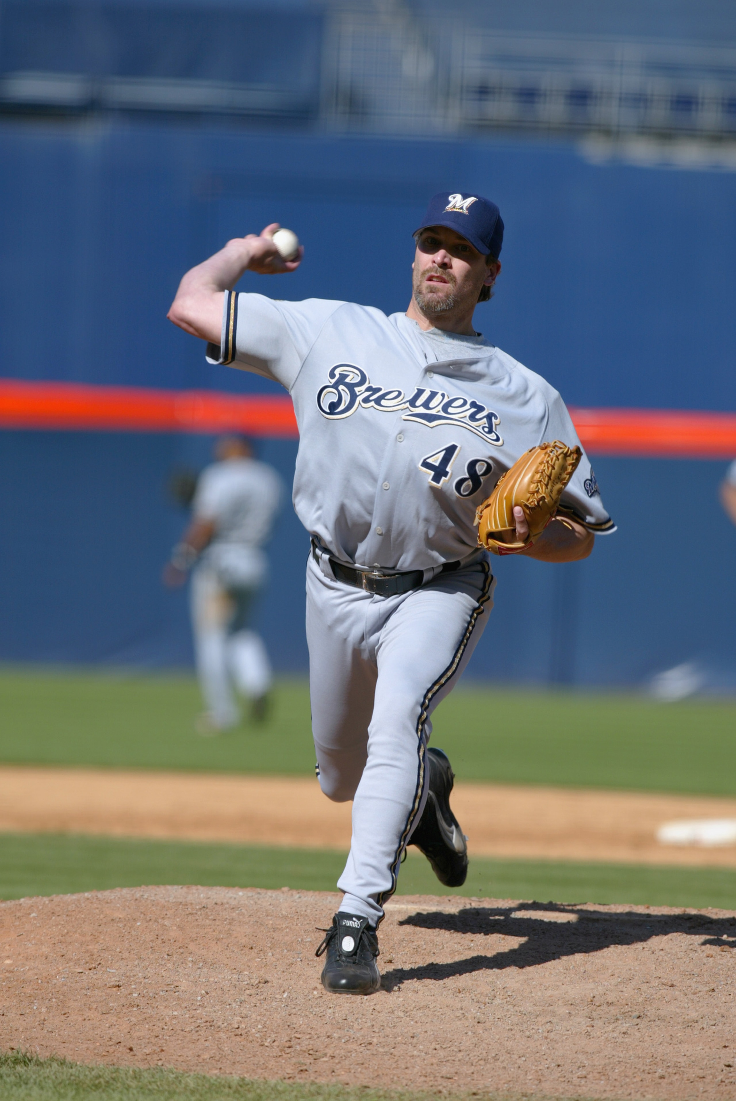 San Diego - JUNE 2:  Mike DeJean #48 of the Milwaukee Brewers pitches the ball during their game against the San Diego Padres on June 2, 2002 at Qualcomm Stadium, in San Diego, California. The Brewers won 4-3.(Photo by Donald Miralle/Getty Images)