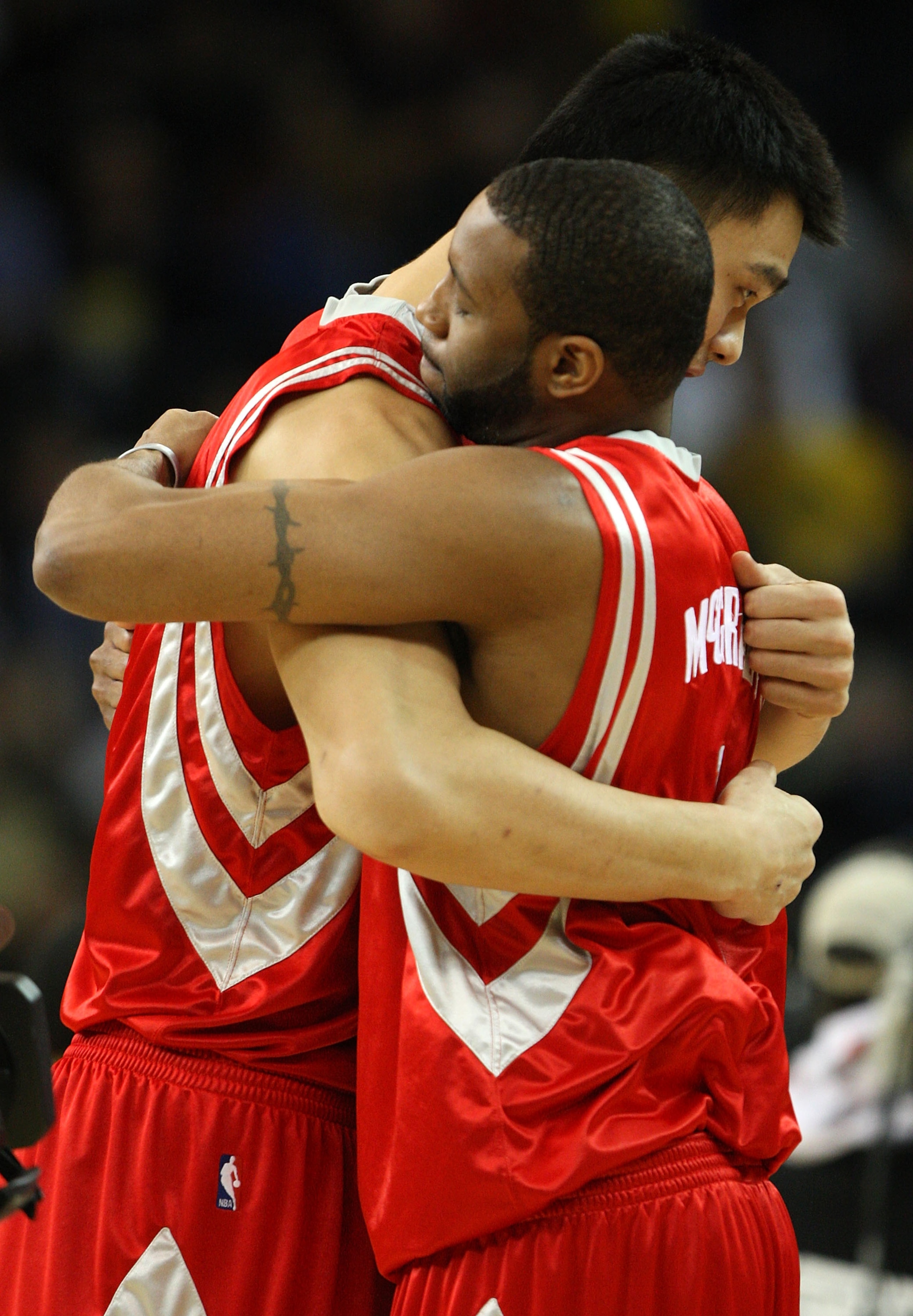 OAKLAND, CA - DECEMBER 12:  Yao Ming #11 and Tracy McGrady #1 of the Houston Rockets hug before their game against the Golden State Warriors during an NBA game on December 12, 2008 at Oracle Arena in Oakland, California. NOTE TO USER: User expressly ackno