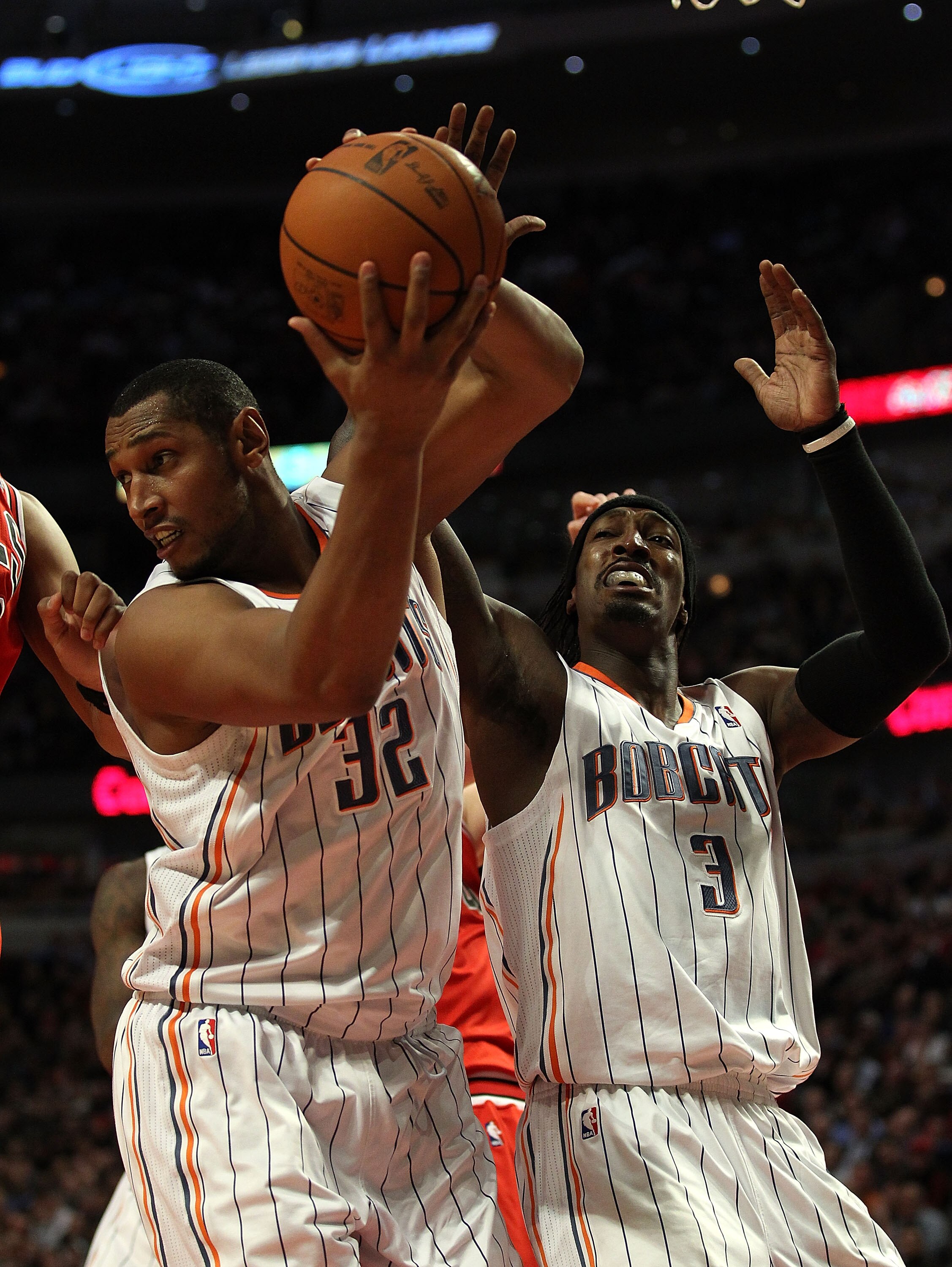 CHICAGO, IL - FEBRUARY 15: Boris Diaw #32 of the Charlotte Bobcats grads a rebound next to teammate Gerald Wallace #3 against the Chicago Bulls at the United Center on February 15, 2011 in Chicago, Illinois. The Bulls defeated the Bobcats 106-94. NOTE TO