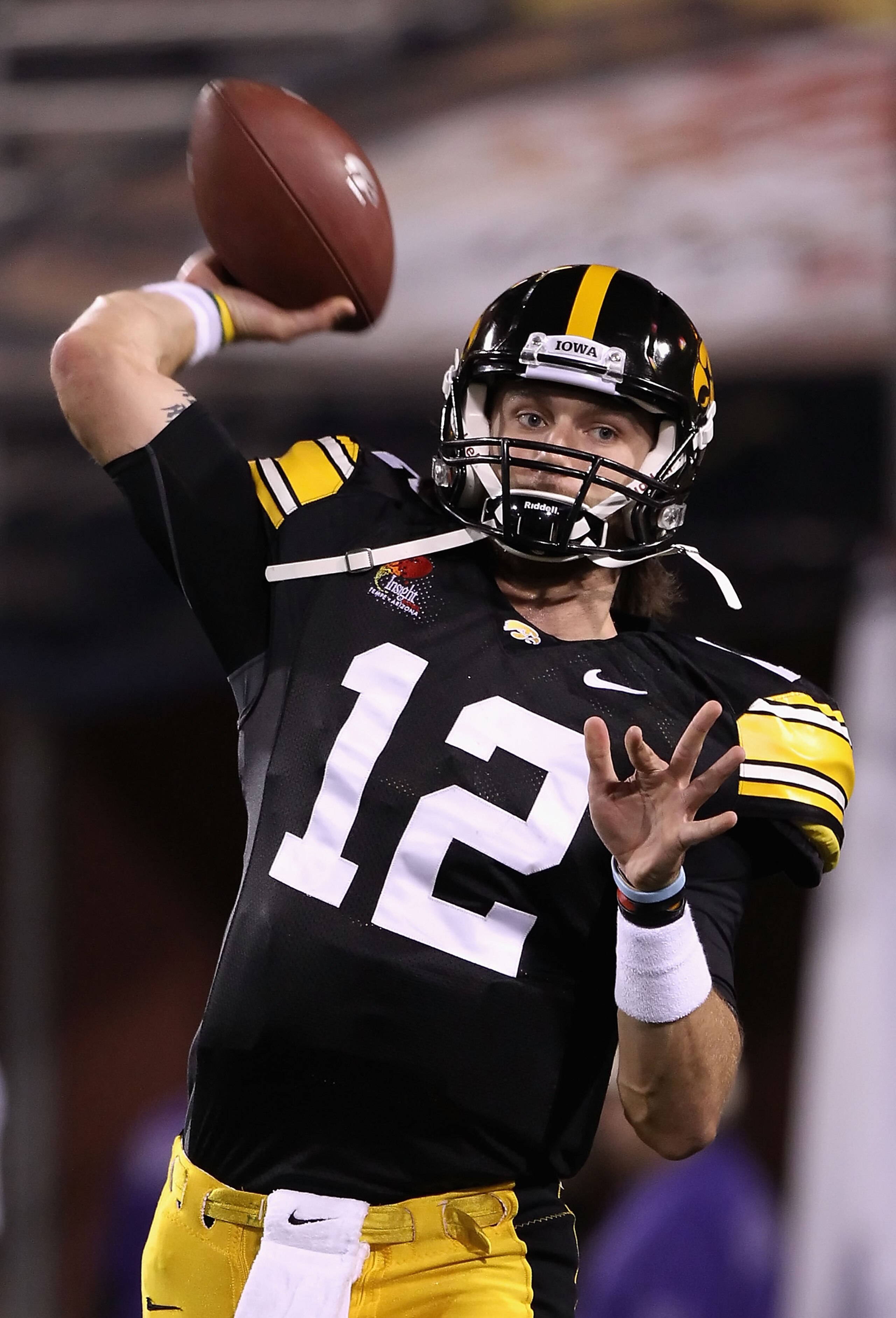TEMPE, AZ - DECEMBER 28:  Quarterback Ricky Stanzi #12 of the Iowa Hawkeyes warms up before the Insight Bowl against the Missouri Tigers at Sun Devil Stadium on December 28, 2010 in Tempe, Arizona.  (Photo by Christian Petersen/Getty Images)