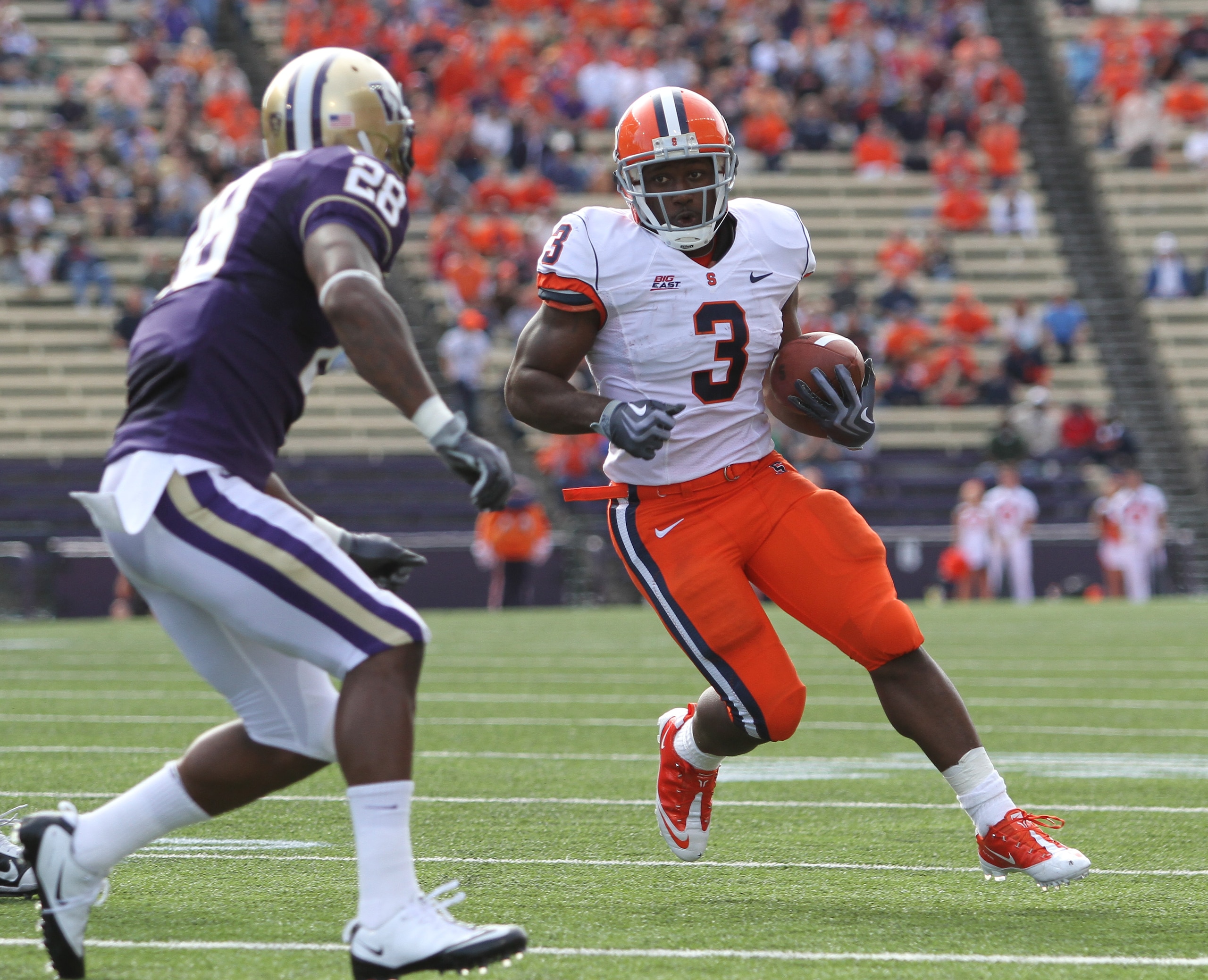 SEATTLE - SEPTEMBER 11:  Running back Delone Carter #3 of the Syracuse Orange rushes against Quinton Richardson #28 of the Washington Huskies on September 11, 2010 at Husky Stadium in Seattle, Washington. (Photo by Otto Greule Jr/Getty Images)