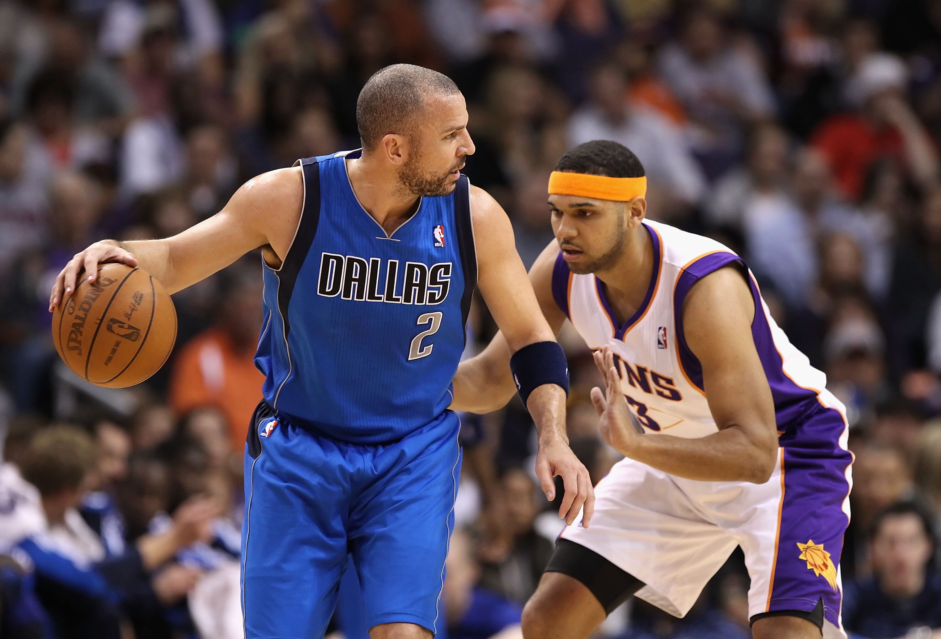PHOENIX, AZ - FEBRUARY 17:  Jason Kidd #2 of the Dallas Mavericks handles the ball under pressure from Jared Dudley #3 of the Phoenix Suns during the NBA game at US Airways Center on February 17, 2011 in Phoenix, Arizona.  NOTE TO USER: User expressly ack