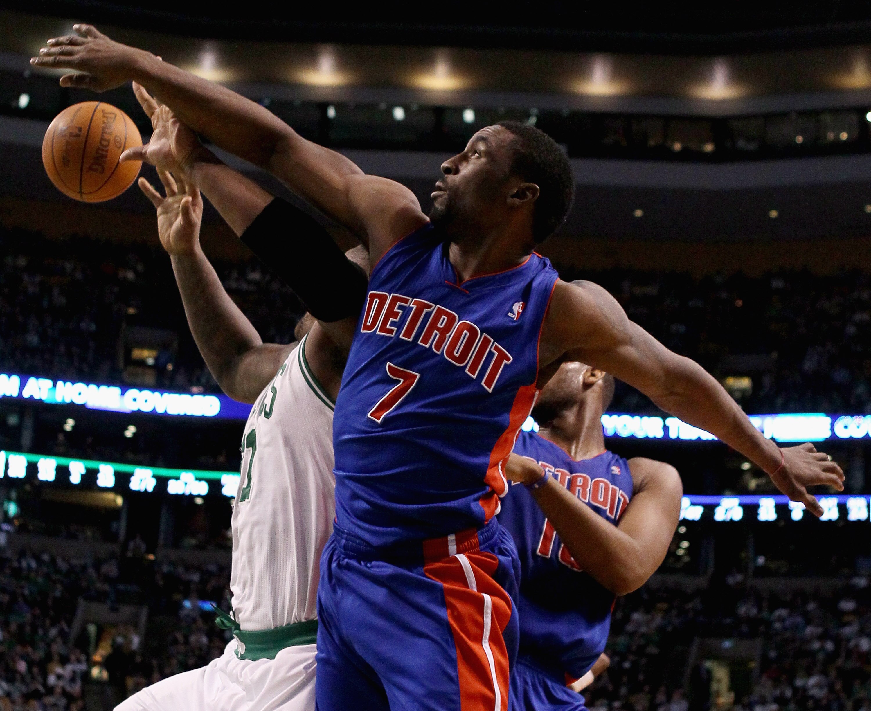 BOSTON, MA - JANUARY 19:  Ben Gordon #7 of the Detroit Pistons and Glen Davis #11 of the Boston Celtics fight for the rebound in the final seconds of the game on January 19, 2011 at the TD Garden in Boston, Massachusetts. The Celtics defeated the Pistons