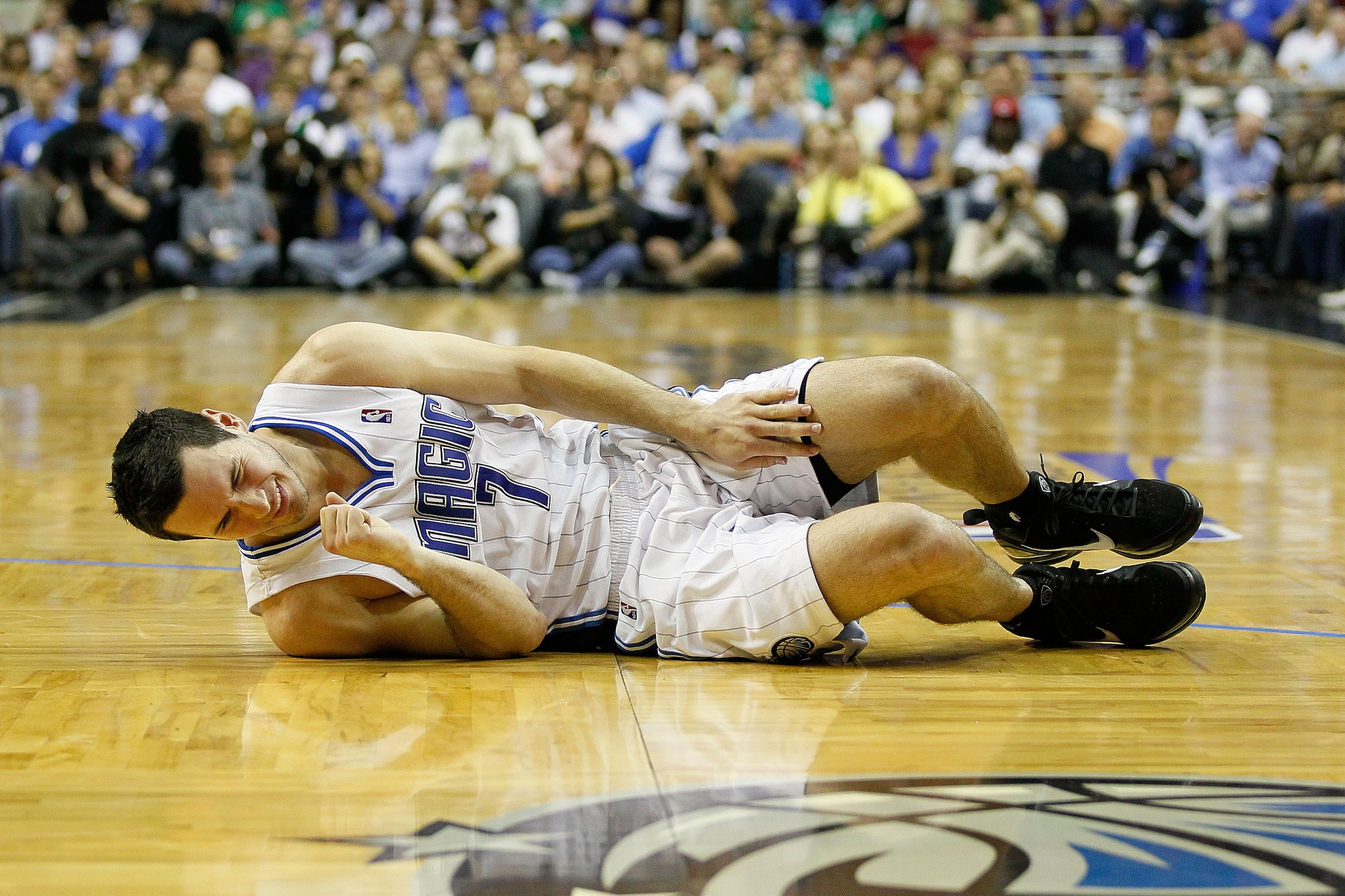 ORLANDO, FL - MAY 18:  J.J. Redick #7 of the Orlando Magic lies on the court in pain against the Boston Celtics in Game Two of the Eastern Conference Finals during the 2010 NBA Playoffs at Amway Arena on May 18, 2010 in Orlando, Florida.  NOTE TO USER: Us