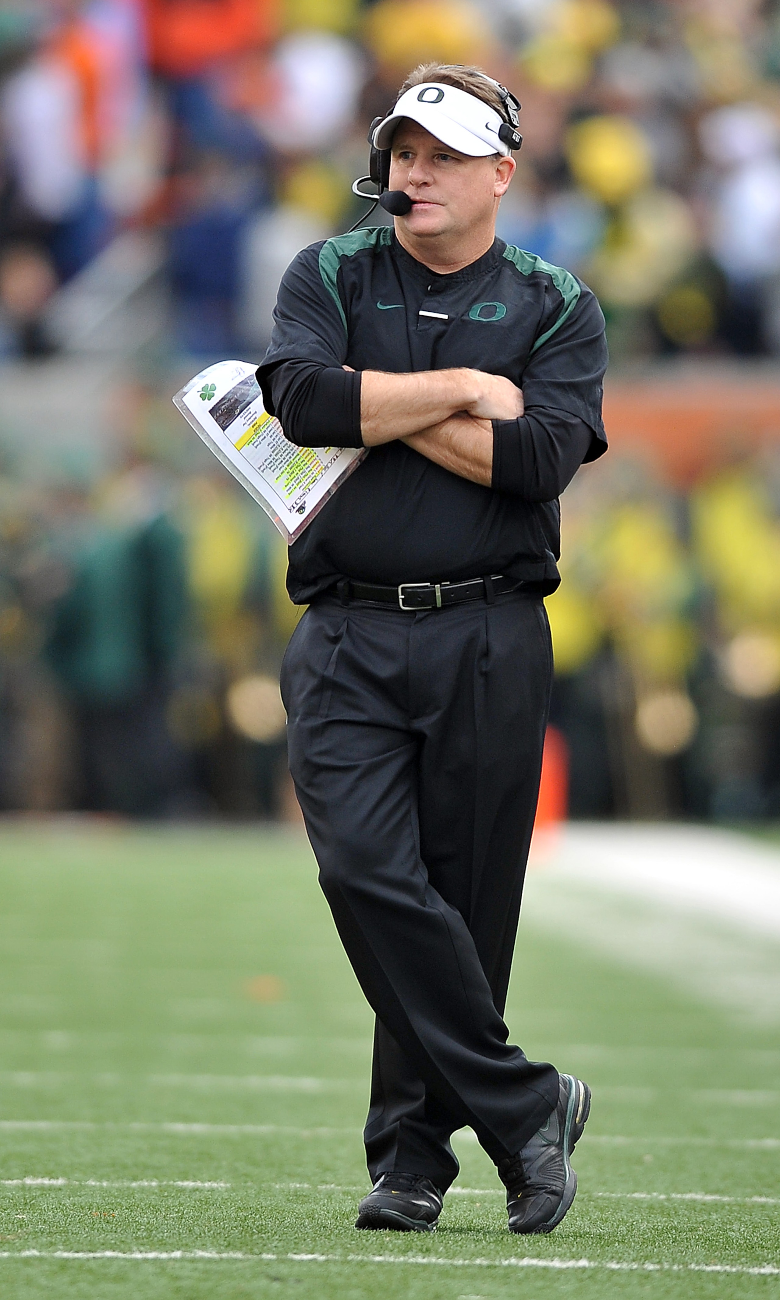 CORVALLIS, OR - DECEMBER 4: Head coach Chip Kelly of the Oregon Ducks looks on from the sidelines in the second quarter of the game against the the Oregon State Beavers at Reser Stadium on December 4, 2010 in Corvallis, Oregon. The Ducks beat the Beavers