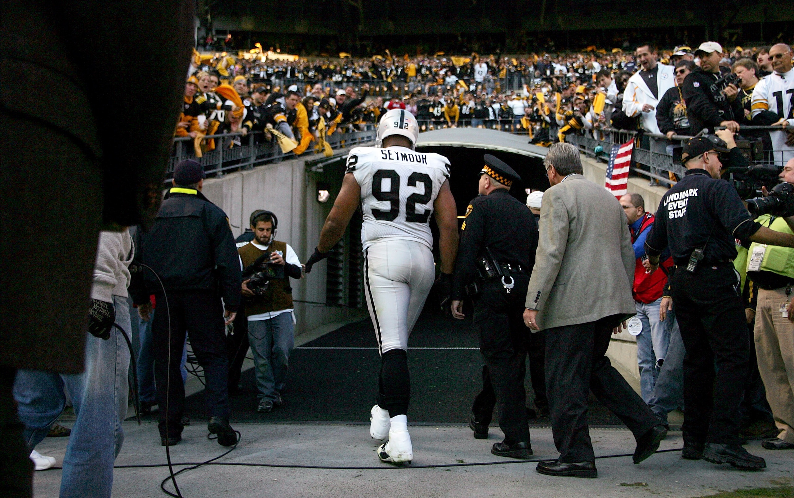PITTSBURGH, PA - NOVEMBER 21:  Richard Seymour #92 of the Oakland Raiders is escorted out of the stadium after being ejected for hitting Ben Roethlisberger #7 of the Pittsburgh Steelers during the game on November 21, 2010 at Heinz Field in Pittsburgh, Pe