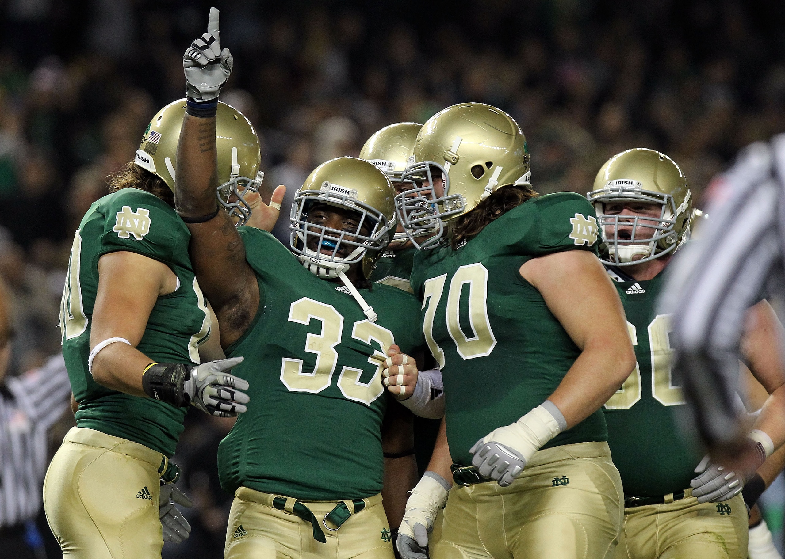 NEW YORK - NOVEMBER 20: Robert Hughes #33 of the Notre Dame Fighting Irish celebrates his touchdown with teammates agianst the Army Black Knights at Yankee Stadium on November 20, 2010 in the Bronx borough of New York City. (Photo by Nick Laham/Getty Ima NEW YORK - NOVEMBER 20: Robert Hughes #33 of the Notre Dame Fighting Irish celebrates his touchdown with teammates agianst the Army Black Knights at Yankee Stadium on November 20, 2010 in the Bronx borough of New York City. (Photo by Nick Laham/Getty Ima
