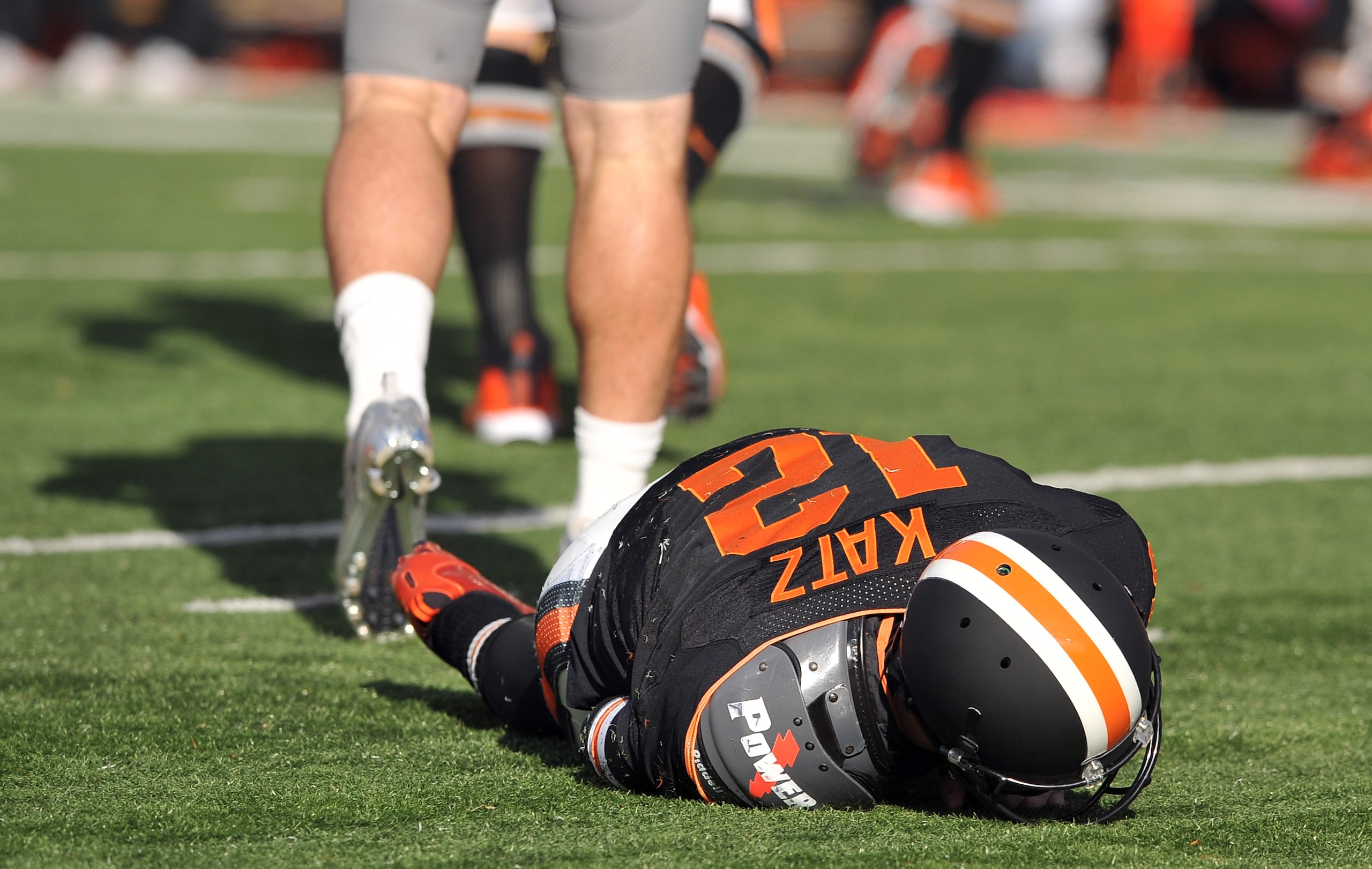 CORVALLIS, OR - DECEMBER 4: Quarterback Ryan Katz #12 of the Oregon State Beavers lays on the turf after being hit by Casey Matthews #55 of the Oregon Ducks in the first quarter of the game at Reser Stadium on December 4, 2010 in Corvallis, Oregon. The Du CORVALLIS, OR - DECEMBER 4: Quarterback Ryan Katz #12 of the Oregon State Beavers lays on the turf after being hit by Casey Matthews #55 of the Oregon Ducks in the first quarter of the game at Reser Stadium on December 4, 2010 in Corvallis, Oregon. The Du