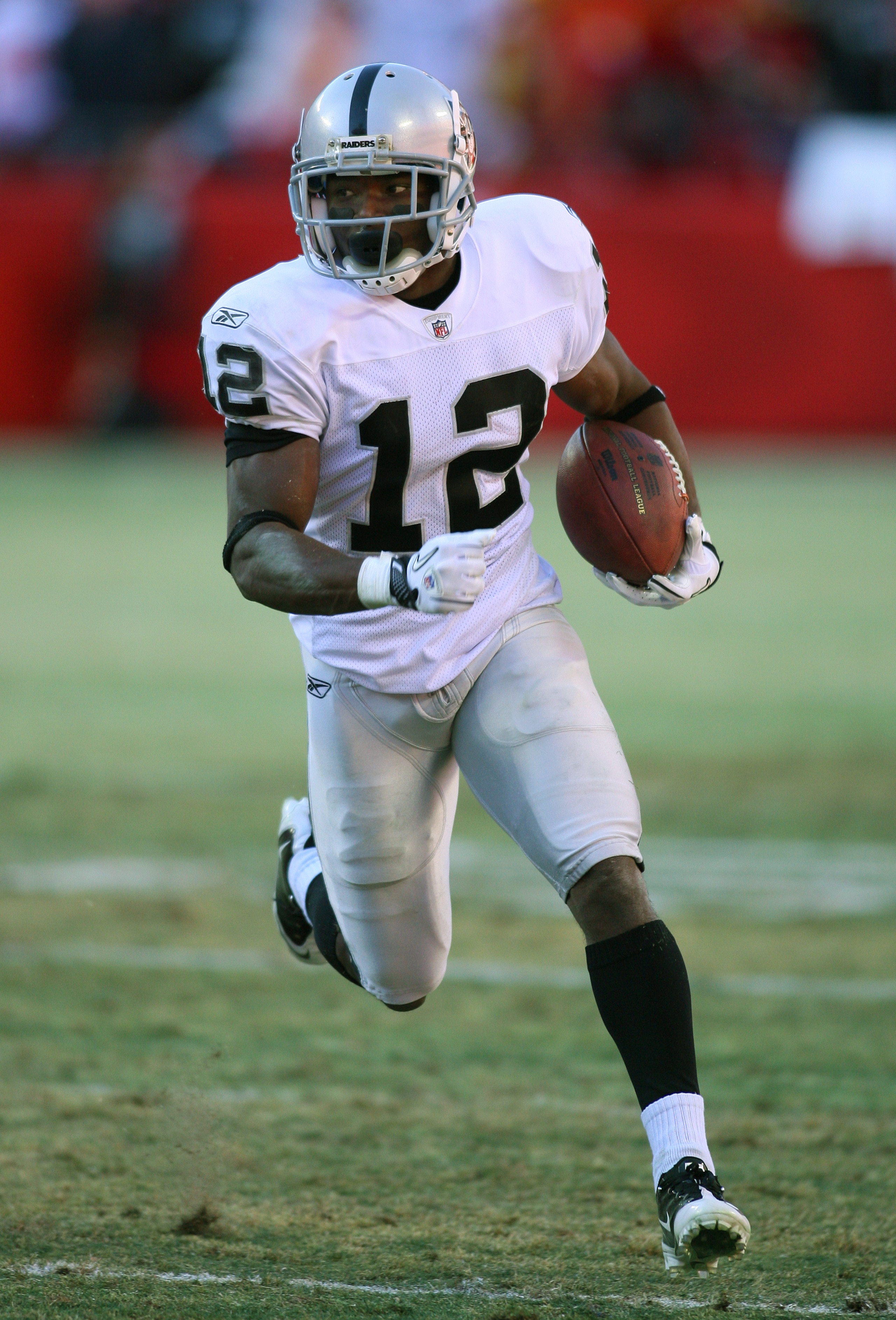 KANSAS CITY, MO - JANUARY 02:  Wide receiver Jacoby Ford #12 of the Oakland Raiders runs down field in a game against the Kansas City Chiefs at Arrowhead Stadium on January 2, 2011 in Kansas City, Missouri.  (Photo by Tim Umphrey/Getty Images)
