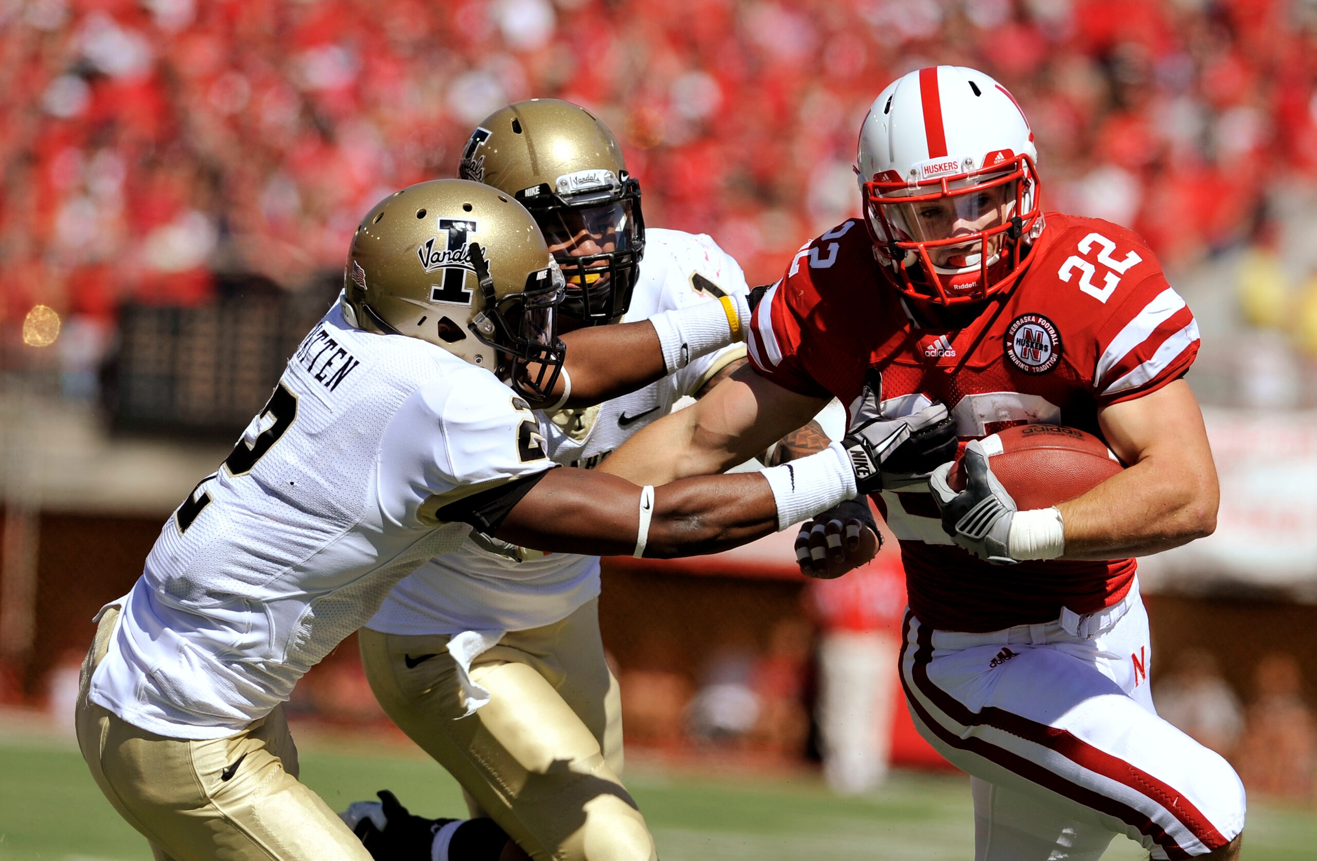 LINCOLN, NE - SEPTEMBER 11: Nebraska Cornhuskers running back Rex Burkhead #22 tries to elude Idaho Vandals cornerback Kenneth Patten #2 and Robert Siavii #1 during first half action of their game at Memorial Stadium on September 4, 2010 in Lincoln, Nebra LINCOLN, NE - SEPTEMBER 11: Nebraska Cornhuskers running back Rex Burkhead #22 tries to elude Idaho Vandals cornerback Kenneth Patten #2 and Robert Siavii #1 during first half action of their game at Memorial Stadium on September 4, 2010 in Lincoln, Nebra