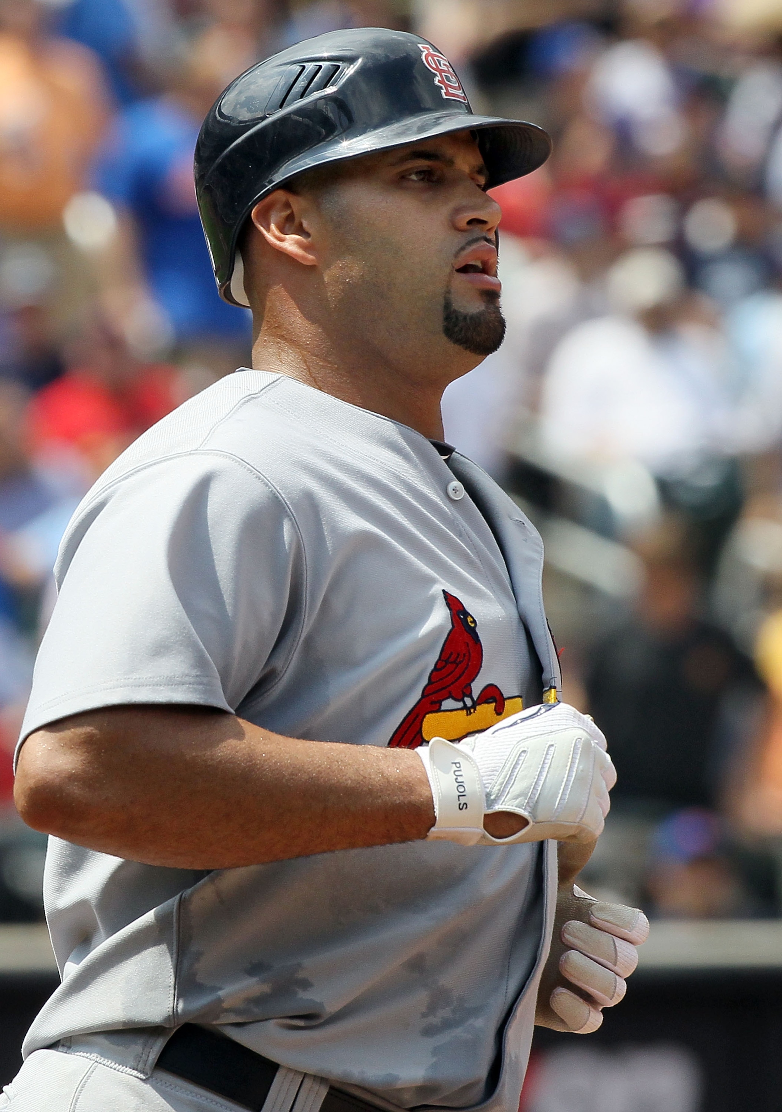 NEW YORK - JULY 29:  Albert Pujols #5 of the St. Louis Cardinals looks on against the New York Mets on July 29, 2010 at Citi Field in the Flushing neighborhood of the Queens borough of New York City. The Mets defeated the Cardinals 4-0.  (Photo by Jim McI