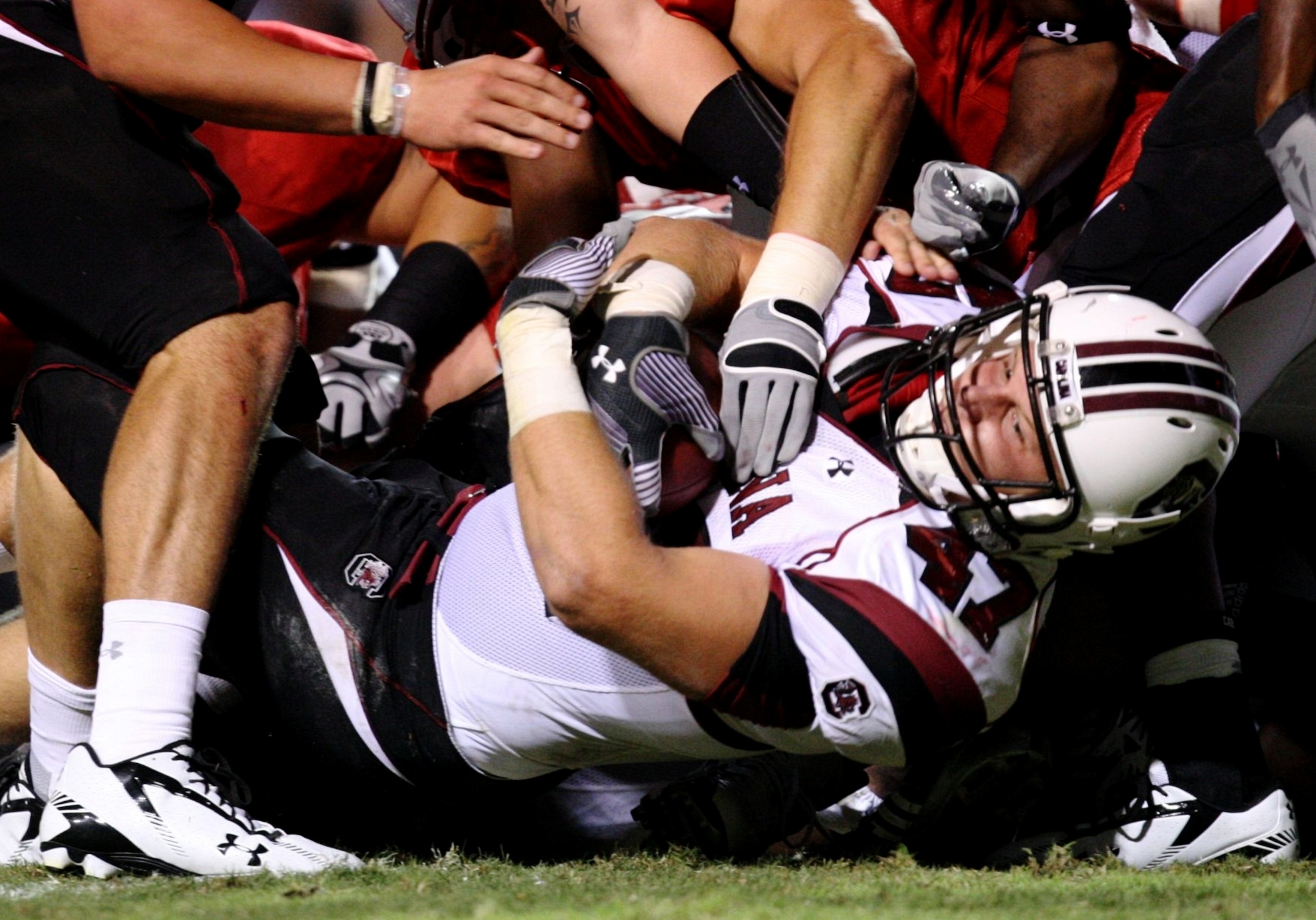RALEIGH, NC - SEPTEMBER 3: Fullback Patrick DiMarco $47 of the South Carolina Gamecocks is tackled during the game against the North Carolina State Wolfpack at Carter-Finley Stadium on September 3, 2009 in Raleigh, North Carolina. (Photo by Streeter Lecka