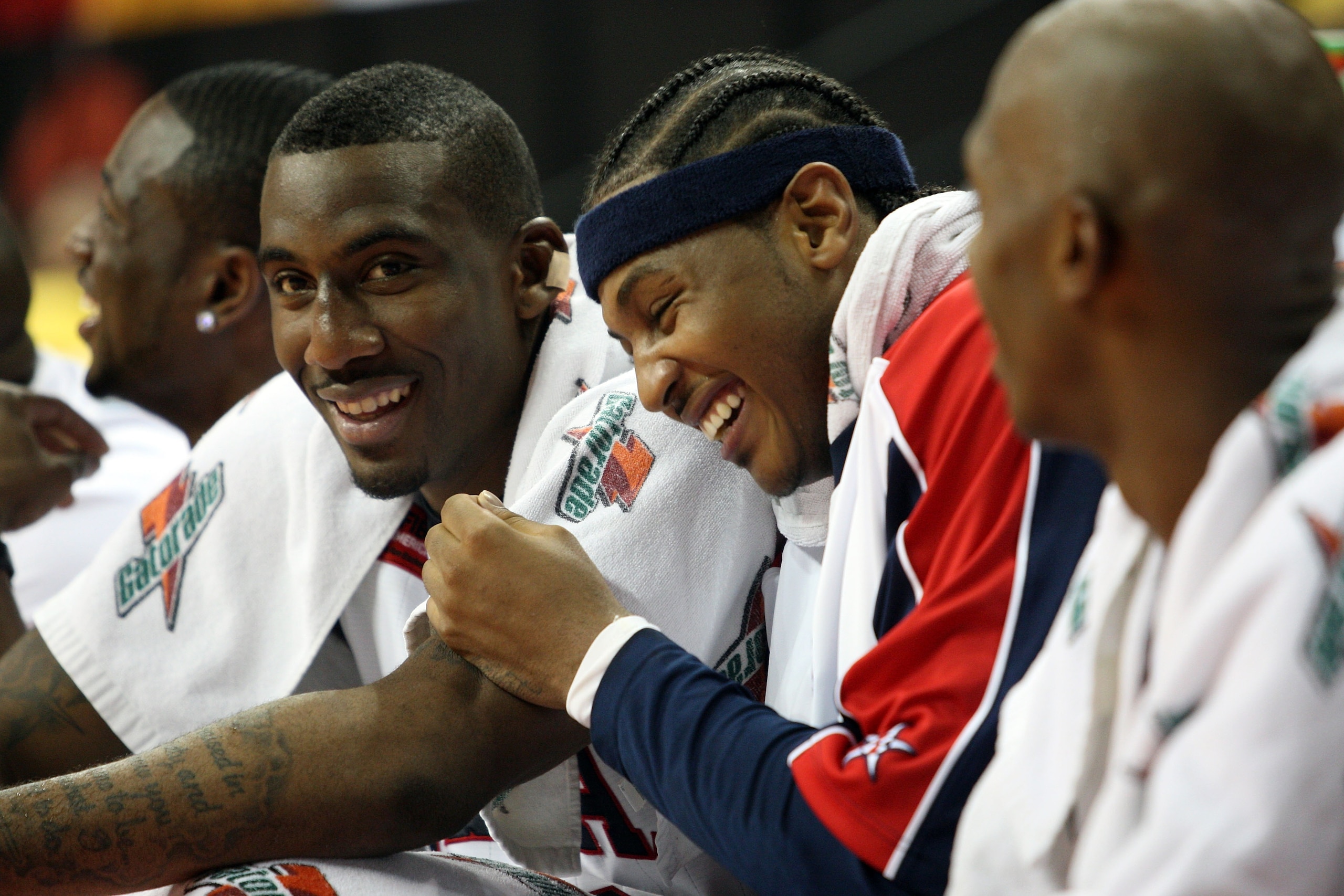 LAS VEGAS - SEPTEMBER 1: Amare Stoudemire #12 and Carmelo Anthony #15 of the USA laugh as they watch from the bench during the FIBA Americas Championship 2007 Semifinal game at the Thomas & Mack Center September 1, 2007 in Las Vegas, Nevada. (Photo by J LAS VEGAS - SEPTEMBER 1: Amare Stoudemire #12 and Carmelo Anthony #15 of the USA laugh as they watch from the bench during the FIBA Americas Championship 2007 Semifinal game at the Thomas & Mack Center September 1, 2007 in Las Vegas, Nevada. (Photo by J