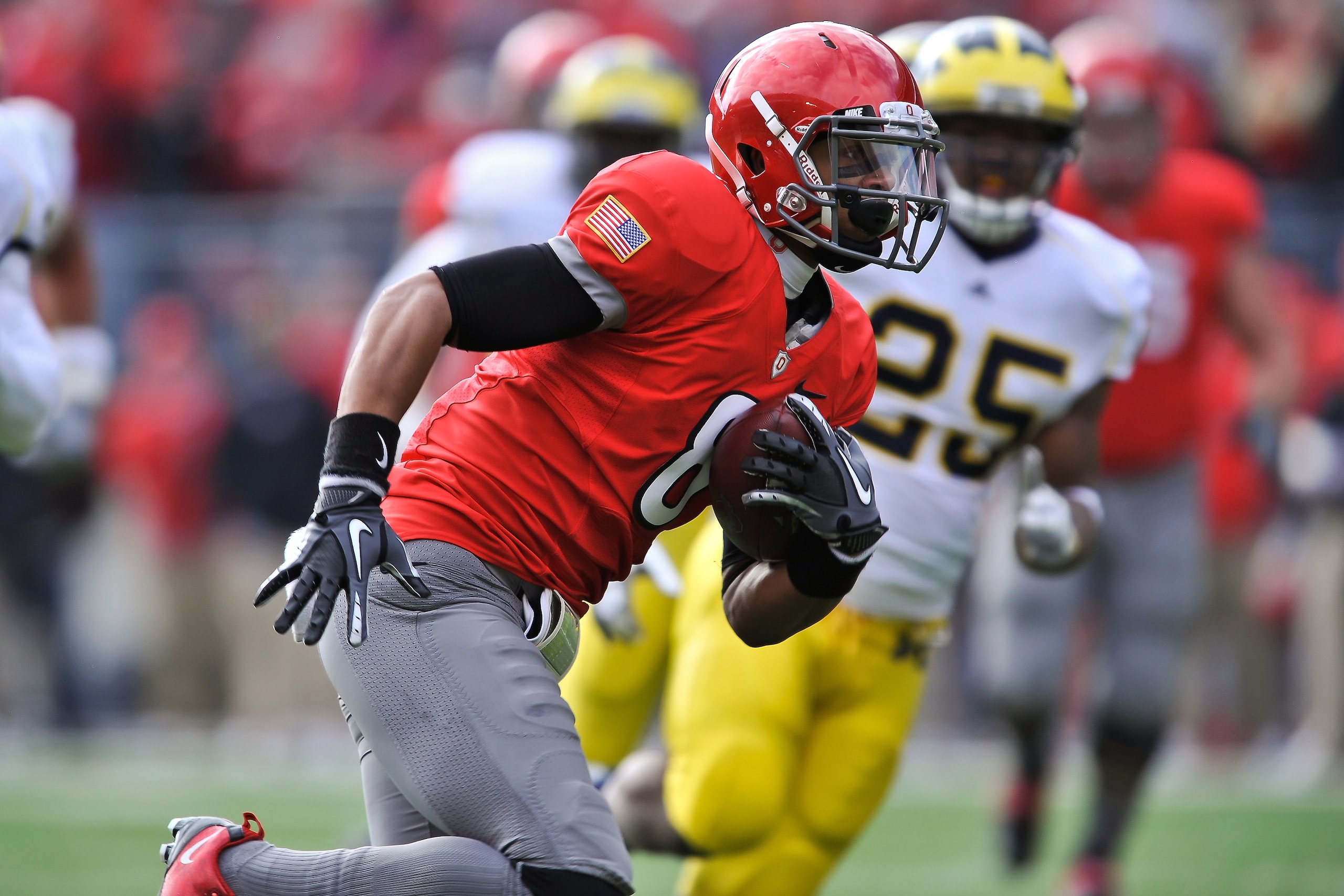 COLUMBUS, OH - NOVEMBER 27:  DeVier Posey #8 of the Ohio State Buckeyes runs with the ball after a pass reception against the Michigan Wolverines at Ohio Stadium on November 27, 2010 in Columbus, Ohio.  (Photo by Jamie Sabau/Getty Images)