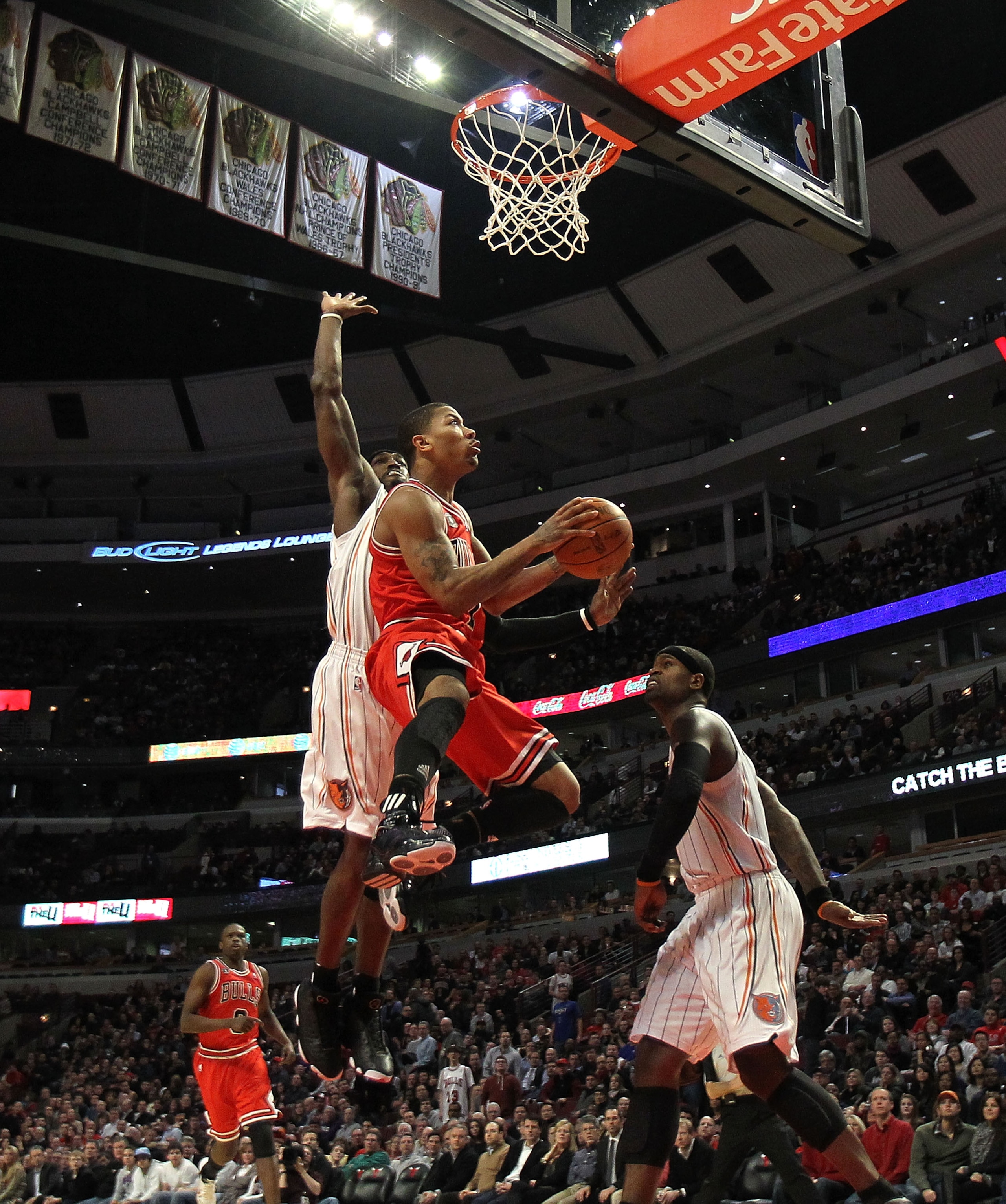 CHICAGO, IL - FEBRUARY 15: Derrick Rose #1 of the Chicago Bulls goes up for a shot against Gerald Wallace #3 and Stephen Jackson #1 of the Charlotte Bobcats at the United Center on February 15, 2011 in Chicago, Illinois. The Bulls defeated the Bobcats 106 CHICAGO, IL - FEBRUARY 15: Derrick Rose #1 of the Chicago Bulls goes up for a shot against Gerald Wallace #3 and Stephen Jackson #1 of the Charlotte Bobcats at the United Center on February 15, 2011 in Chicago, Illinois. The Bulls defeated the Bobcats 106