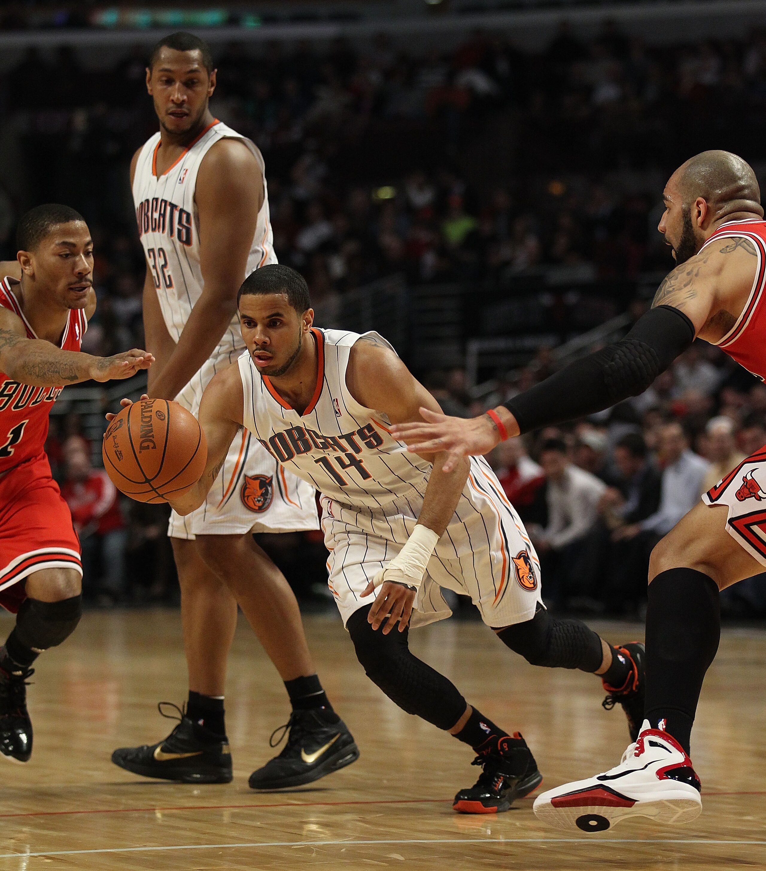 CHICAGO, IL - FEBRUARY 15: D.J. Augustin #14 of the Charlotte Bobcats moves past a screen set by teammate Boris Diaw #32 against Derrick Rose #1 and Carlos Boozer #5 of the Chicago Bulls at the United Center on February 15, 2011 in Chicago, Illinois. The CHICAGO, IL - FEBRUARY 15: D.J. Augustin #14 of the Charlotte Bobcats moves past a screen set by teammate Boris Diaw #32 against Derrick Rose #1 and Carlos Boozer #5 of the Chicago Bulls at the United Center on February 15, 2011 in Chicago, Illinois. The