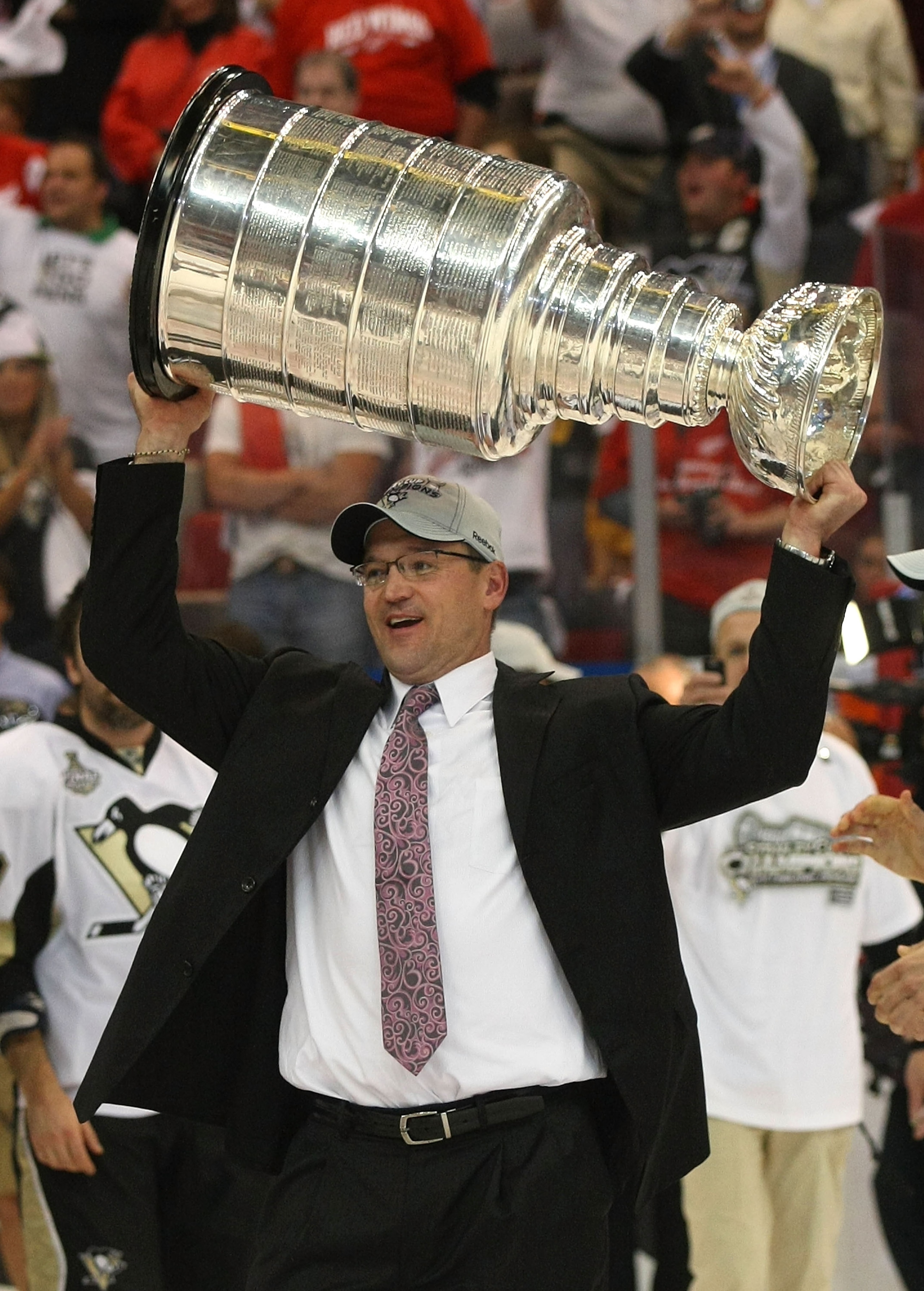 DETROIT - JUNE 12:  Head coach Dan Bylsma of the Pittsburgh Penguins celebrates with the Stanley Cup after defeating the Detroit Red Wings by a score of 2-1 to win Game Seven and the 2009 NHL Stanley Cup Finals at Joe Louis Arena on June 12, 2009 in Detro
