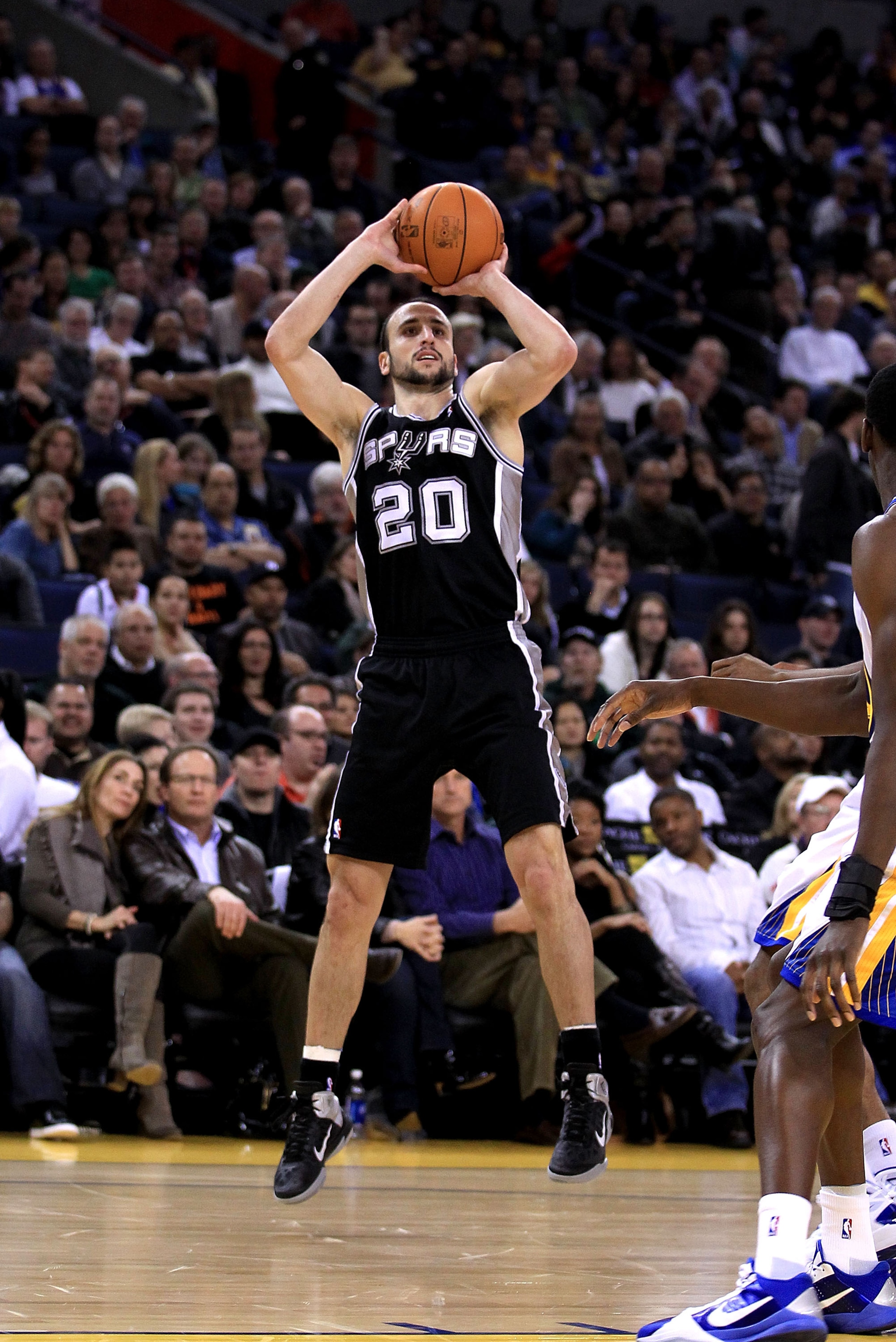 OAKLAND, CA - JANUARY 24:  Manu Ginobili #20 of the San Antonio Spurs in action against the Golden State Warriors at Oracle Arena on January 24, 2011 in Oakland, California.  NOTE TO USER: User expressly acknowledges and agrees that, by downloading and or