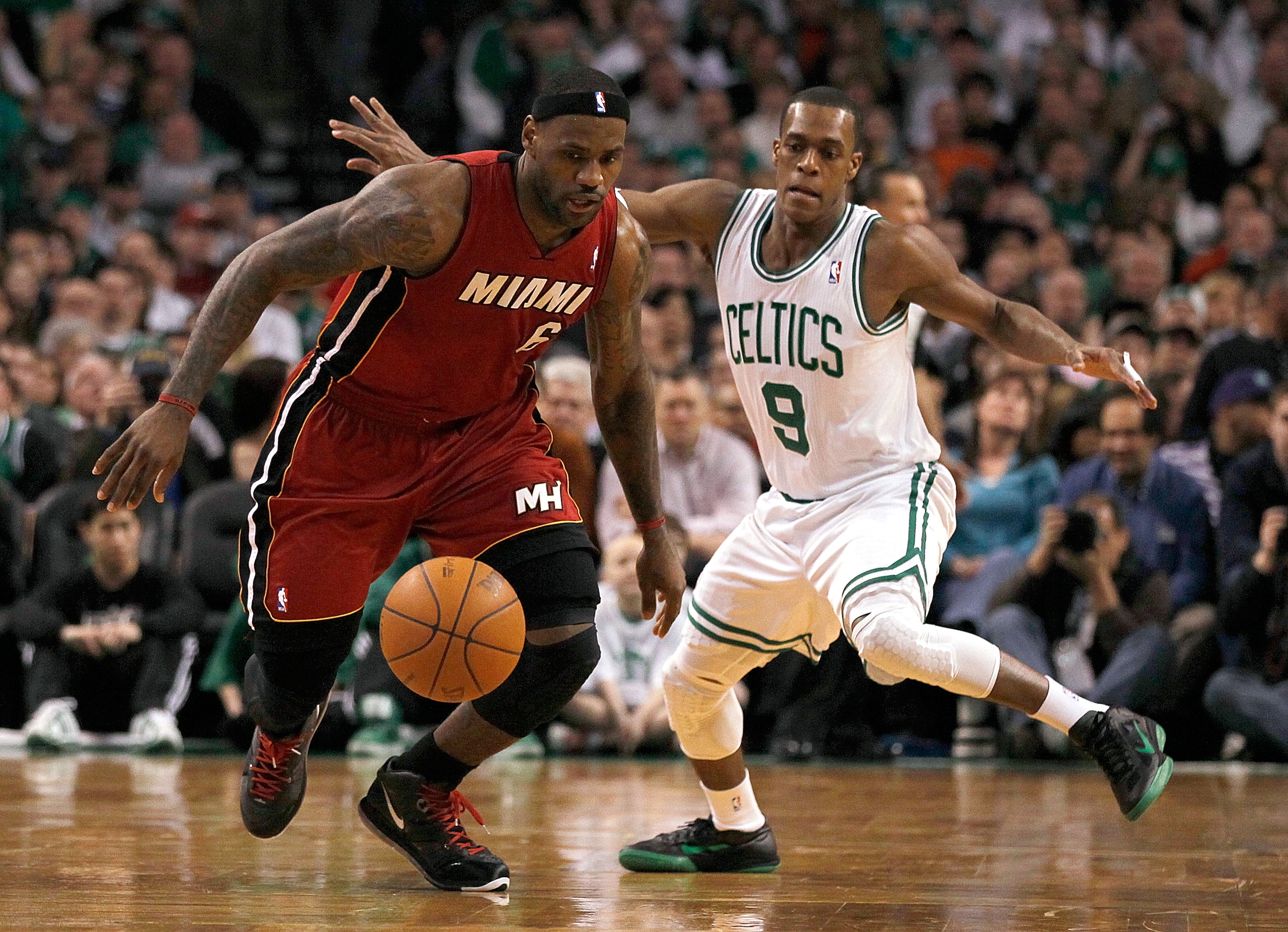 BOSTON - FEBRUARY 13:  LeBron James #6 of the Miami Heat battles Rajon Rondo #9 of the Boston Celtics for control of the ball at TD Garden on February 13, 2011 in Boston, Massachusetts. NOTE TO USER: User expressly acknowledges and agrees that, by downloa