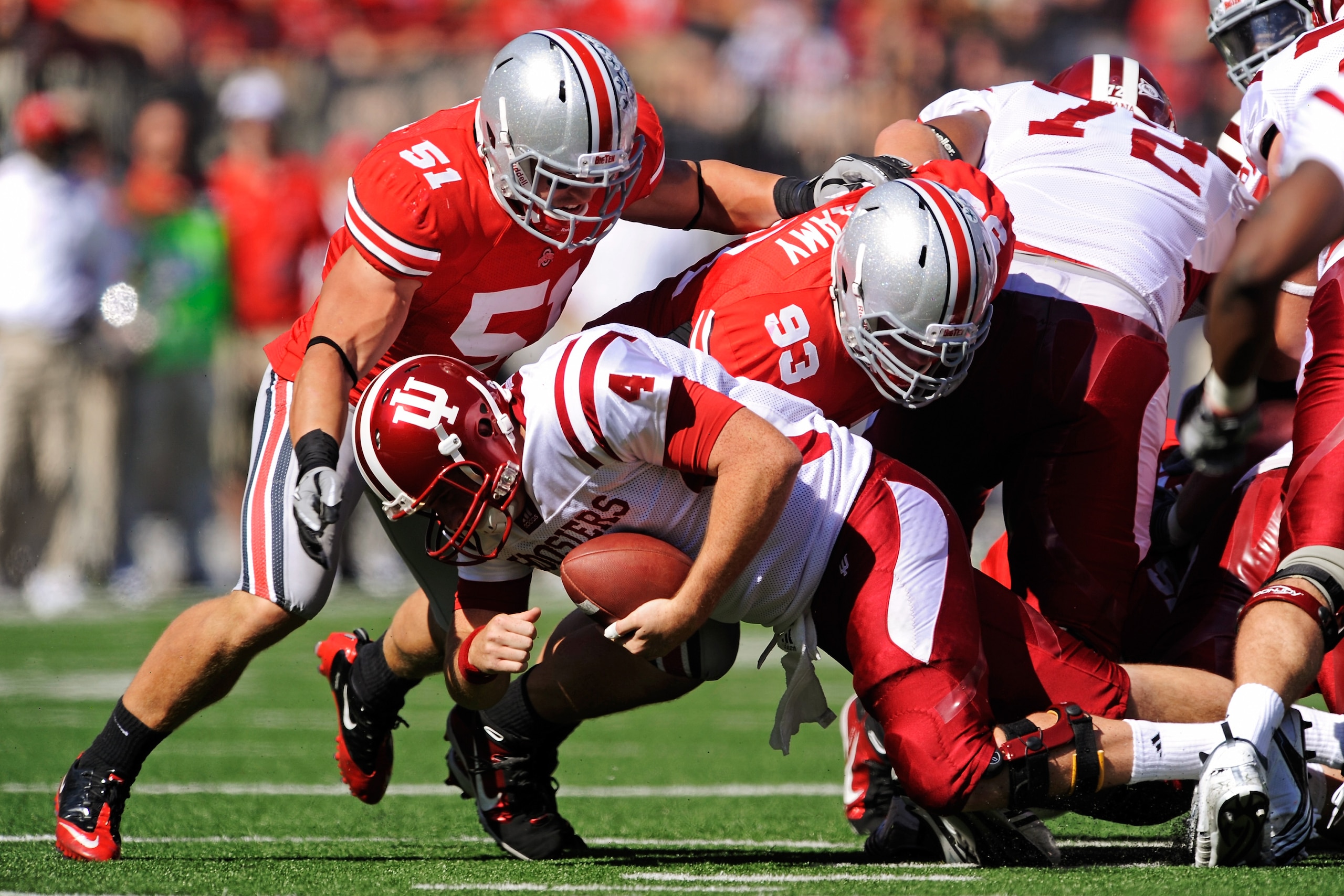 COLUMBUS, OH - OCTOBER 9:  Quarterback Ben Chappell #4 of the Indiana Hoosiers is stopped for no gain on a third and one  situation by Ross Homan #51 and Adam Bellamy #93 of the Ohio State Buckeyes at Ohio Stadium on October 9, 2010 in Columbus, Ohio.  (P