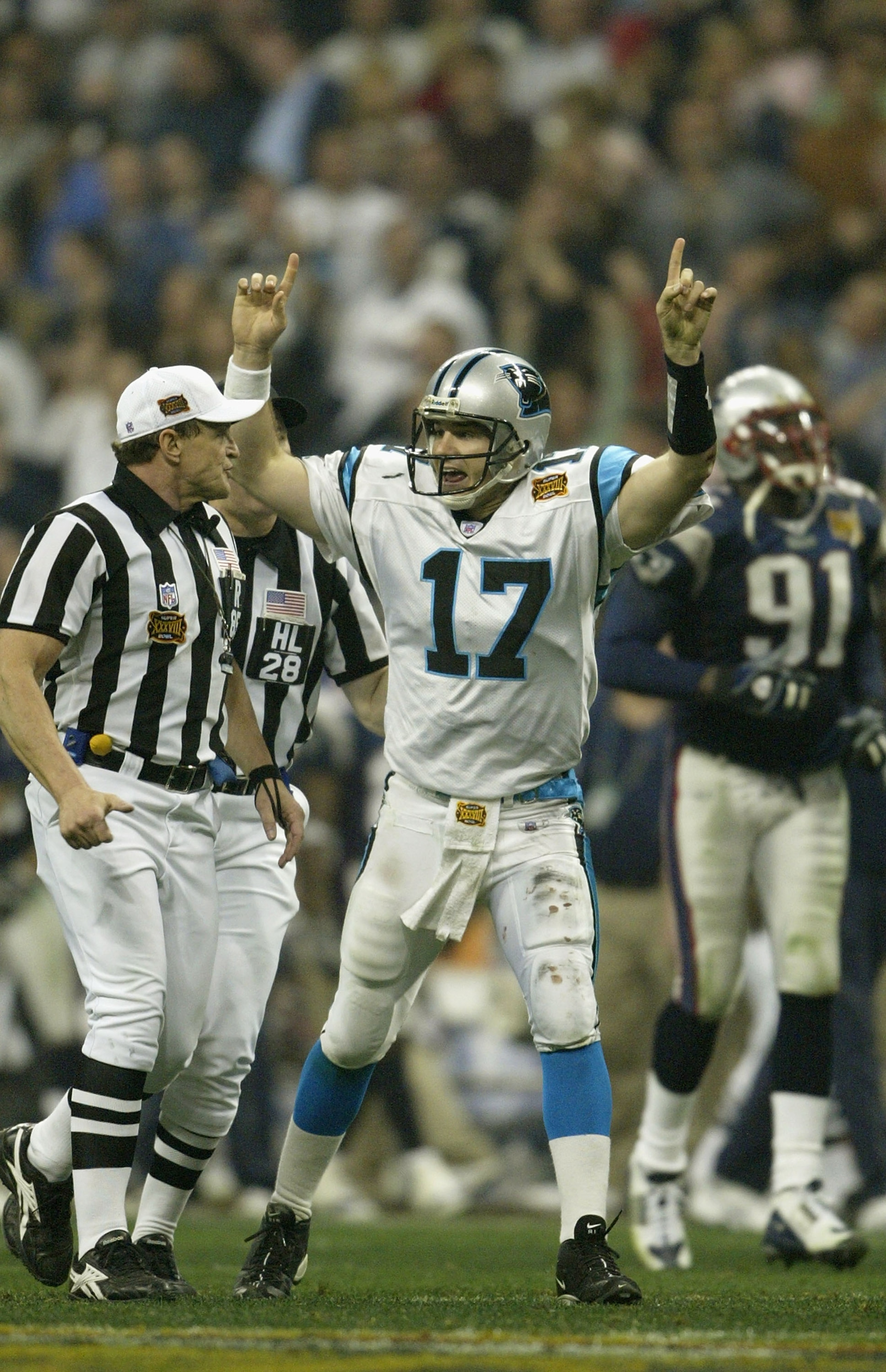 HOUSTON, TX - FEBRUARY 1:  Quarterback Jake Delhomme #17 of the Carolina Panthers celebrates his 85 yard touchdown pass to Muhsin Muhammad #87 against the New England Patriots during the fourth quarter of Super Bowl XXXVIII at Reliant Stadium on February