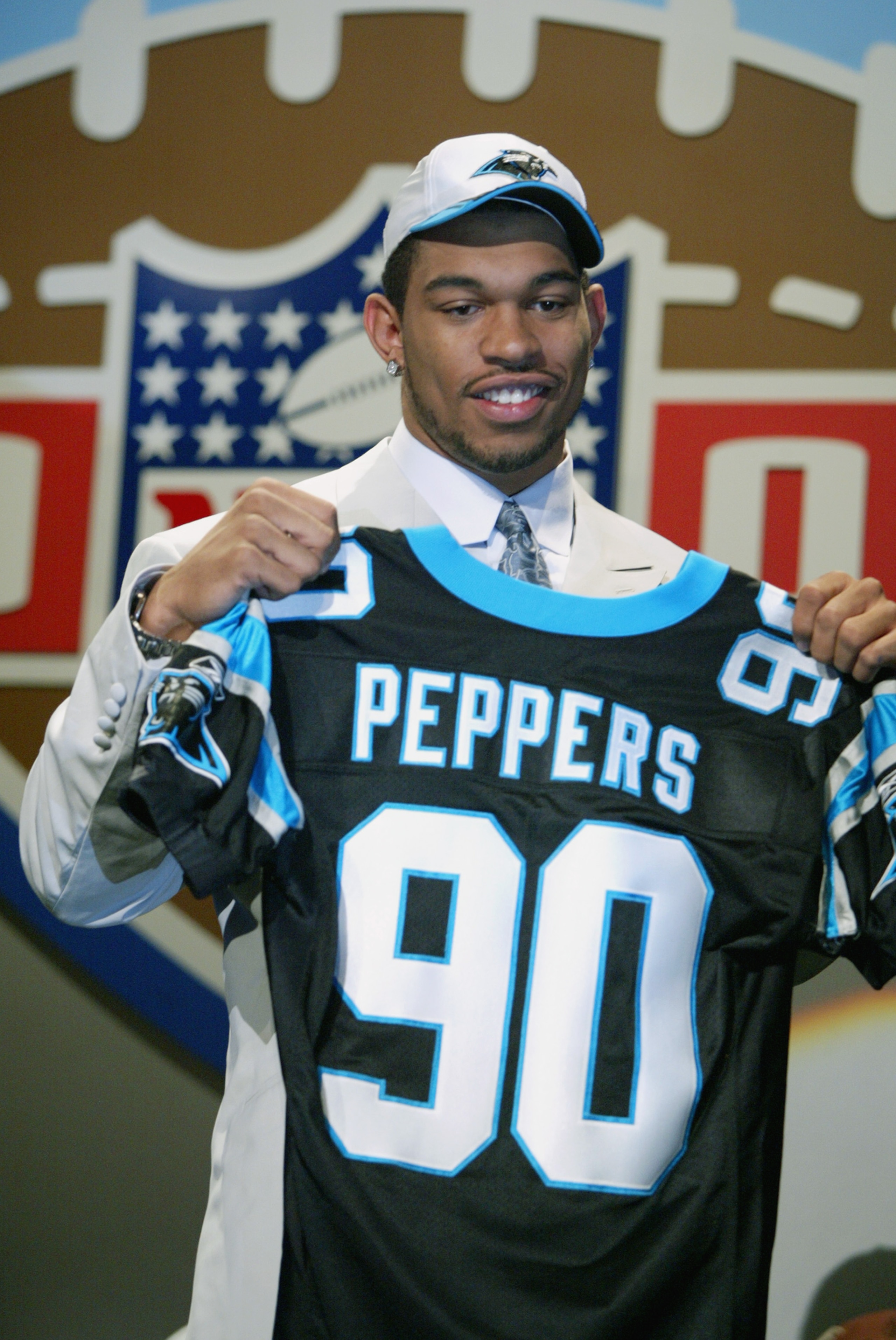 NEW YORK - APRIL 20:   Julius Peppers of North Carolina  is picked 2nd  in the NFL Draft by the Carolina Panthers at the Theatre in Madison Square Garden in New York City, New York on April 20, 2002..   Digital Image. (Photo by Al Bello/Getty Images)
