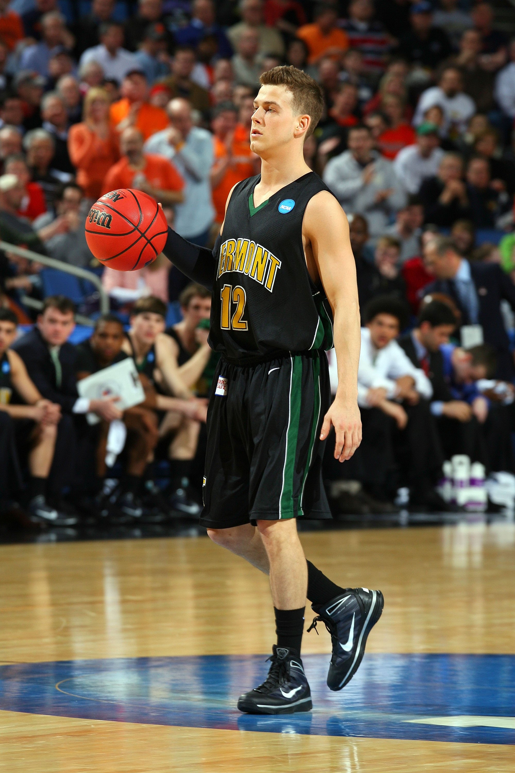 BUFFALO, NY - MARCH 19: Nick Vier #12 of the Vermont Catamounts handles the ball against the Syracuse Orange during the first round of the 2010 NCAA men's basketball tournament at HSBC Arena on March 19, 2010 in Buffalo, New York. (Photo by Rick Stewart