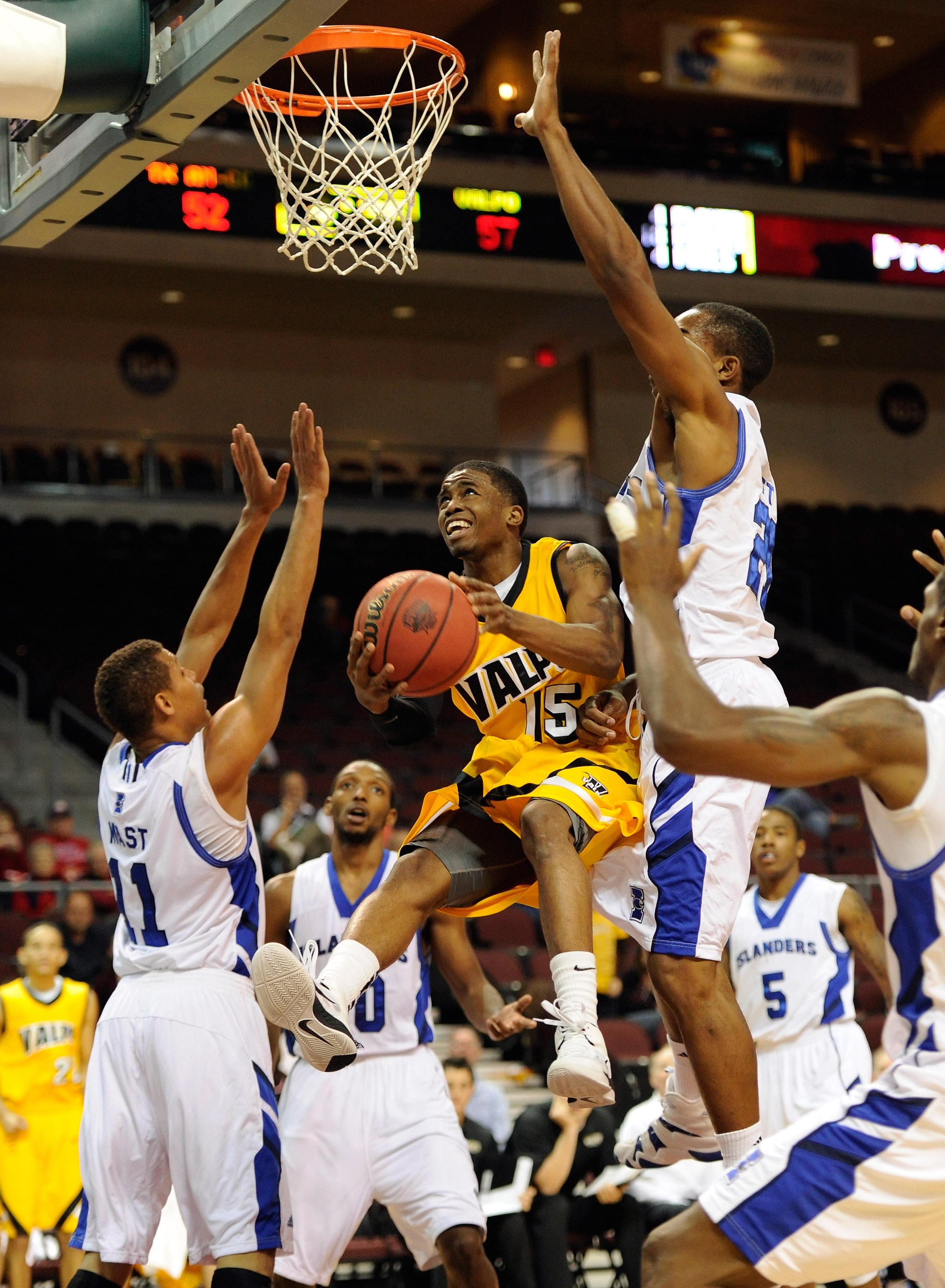 LAS VEGAS - NOVEMBER 27: Erik Buggs #15 of the Valparaiso Crusaders is fouled by Demond Watt (R) #21 of the Texas A&M-Corpus Christi Islanders as the Islanders; #11 Chris Mast defends during the fourth round of the Las Vegas Invitational at The Orleans A