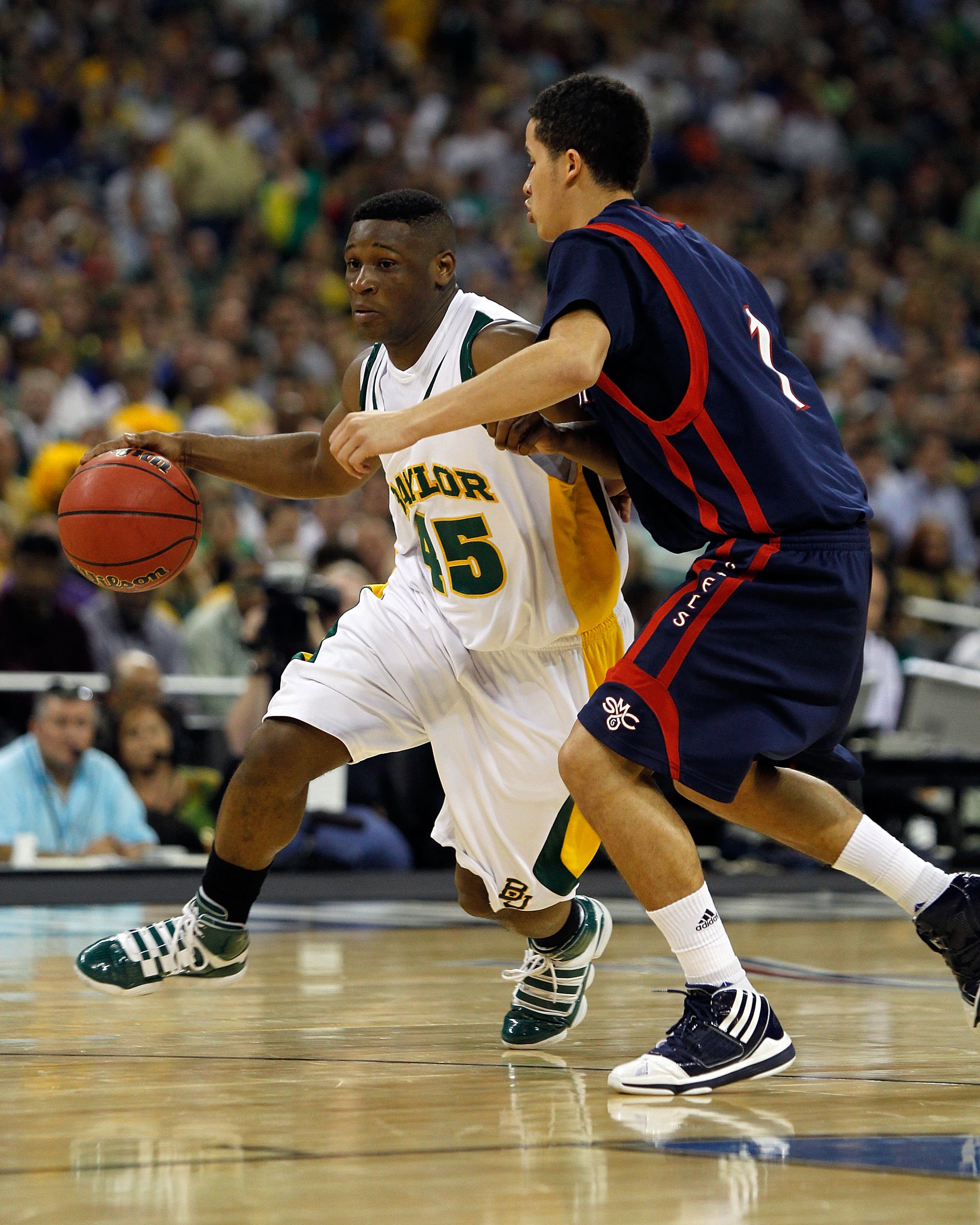 HOUSTON - MARCH 26: Tweety Carter #45 of the Baylor Bears moves against Jorden Page #1 of the St. Mary's Gaels during the south regional semifinal of the 2010 NCAA men's basketball tournament at Reliant Stadium on March 26, 2010 in Houston, Texas. Baylor