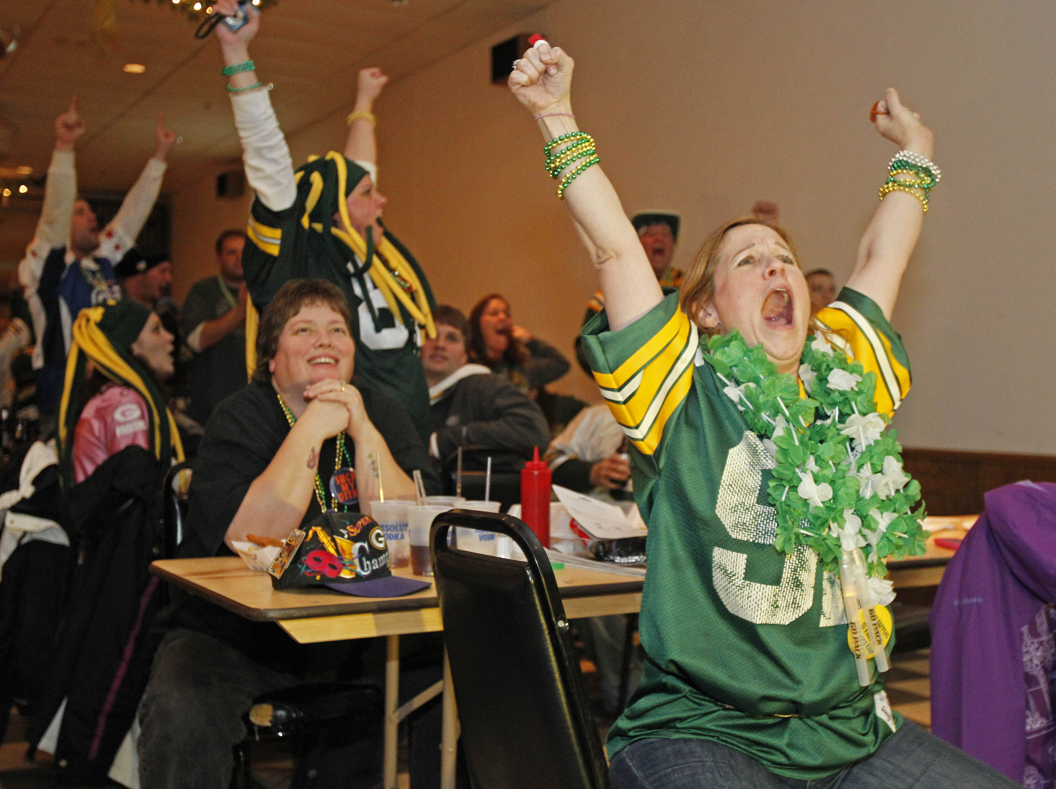 GREEN BAY, WI - FEBRUARY 06: Green Bay Packers fan Kitzi Muniz cheers after a play while watching the Super Bowl at Stadium View Bar on February 6, 2011 in Green Bay, Wisconsin.  (Photo by Matt Ludtke/Getty Images)