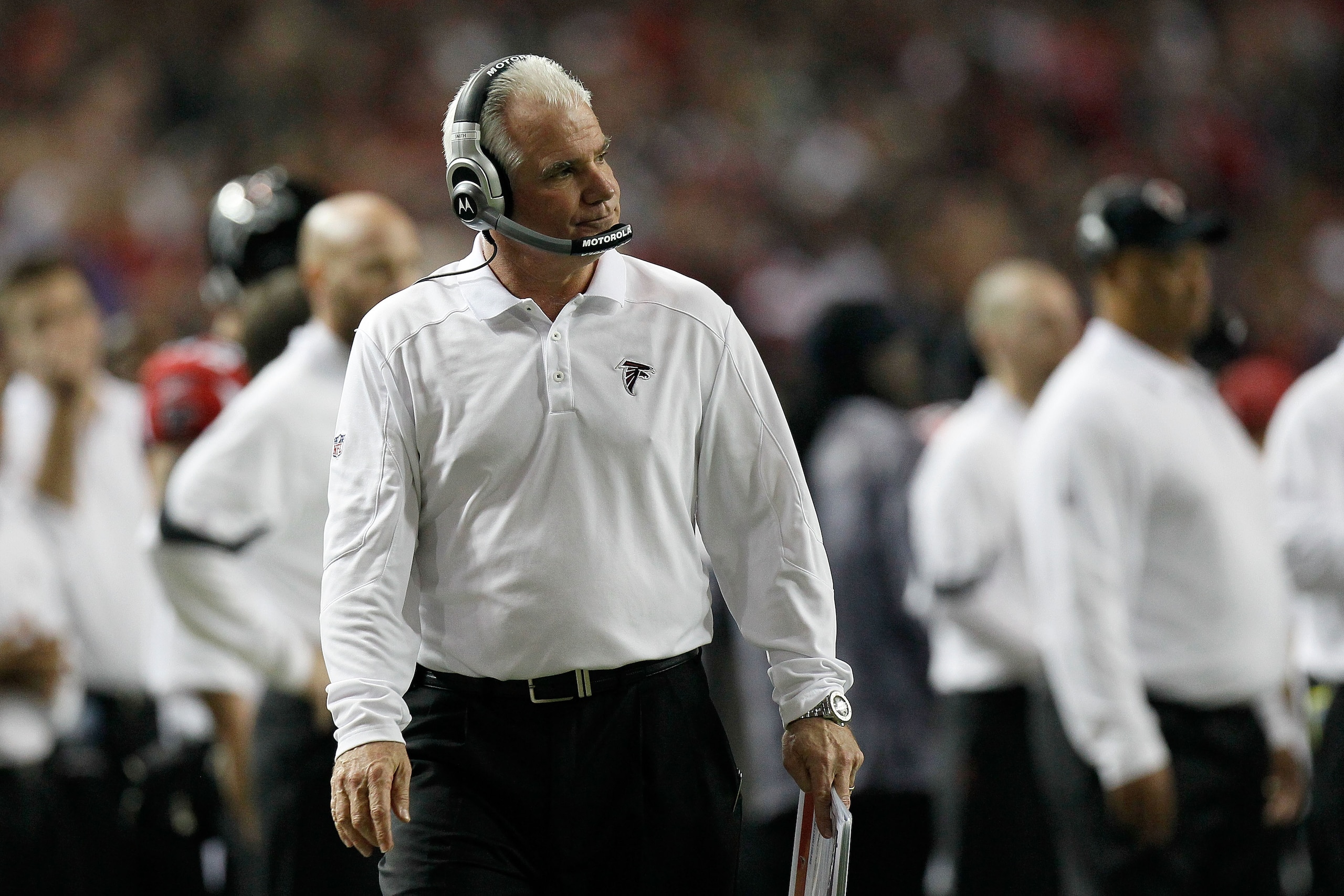ATLANTA, GA - JANUARY 15: Head coach Mike Smith of the Atlanta Falcons looks on as he coaches against the Green Bay Packers during their 2011 NFC divisional playoff game at Georgia Dome on January 15, 2011 in Atlanta, Georgia. The Packers won 48-21. (Pho ATLANTA, GA - JANUARY 15: Head coach Mike Smith of the Atlanta Falcons looks on as he coaches against the Green Bay Packers during their 2011 NFC divisional playoff game at Georgia Dome on January 15, 2011 in Atlanta, Georgia. The Packers won 48-21. (Pho