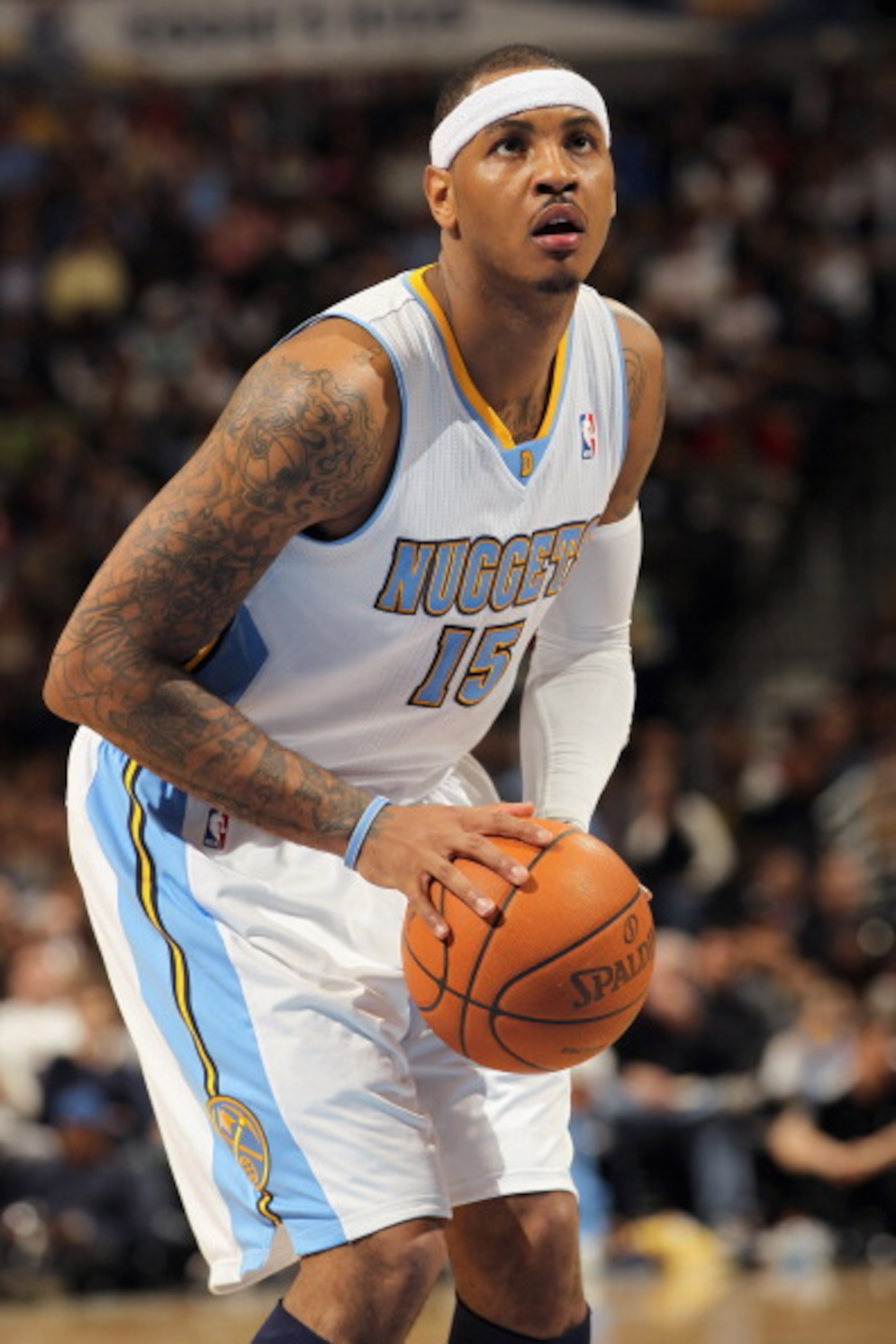 DENVER, CO - FEBRUARY 10:  Carmelo Anthony #15 of the Denver Nuggets takes a free throw against the Dallas Mavericks during NBA action at the Pepsi Center on February 10, 2011 in Denver, Colorado. The Nuggets defeated the Mavericks 121-120. NOTE TO USER: