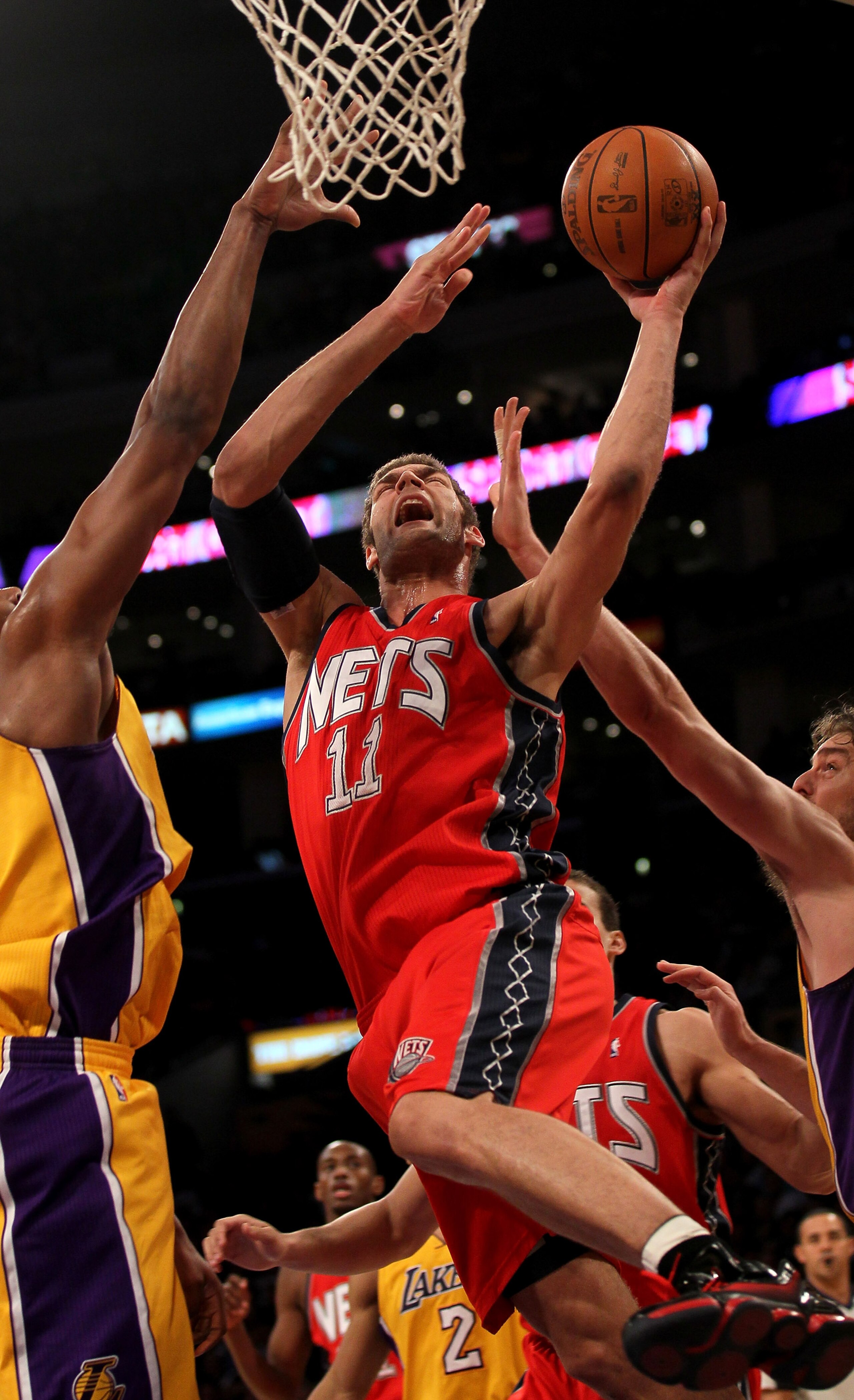 LOS ANGELES, CA - JANUARY 14:  Brook Lopez #11 of the New Jersey Netsgoes up for a shot against the Los Angeles Lakers at Staples Center on January 14, 2011 in Los Angeles, California.  NOTE TO USER: User expressly acknowledges and agrees that, by downloa