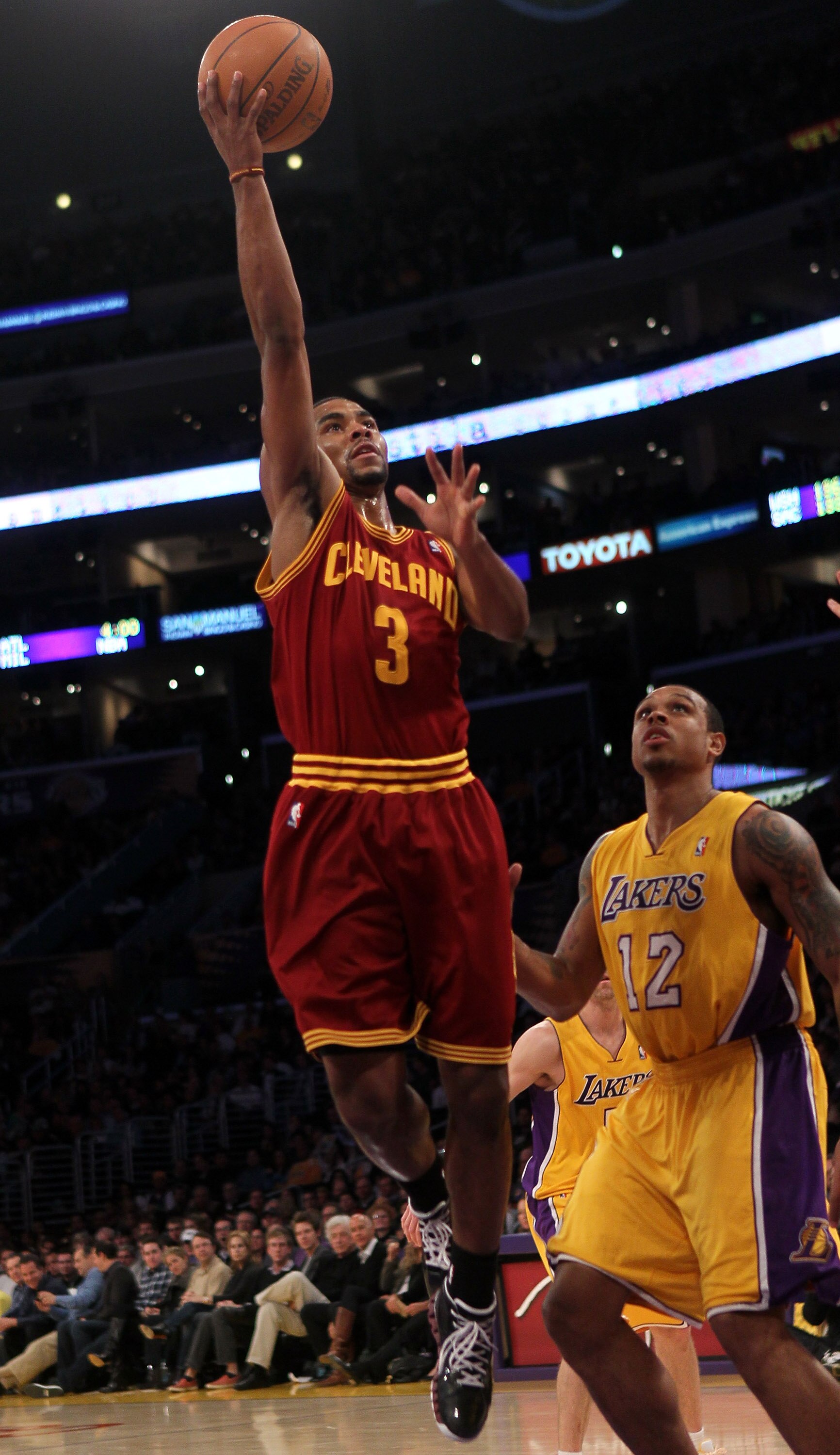 LOS ANGELES, CA - JANUARY 11:  Ramon Sessions #3 of the Cleveland Cavaliers shoots over Shannon Brown #12 of the Los Angeles Lakers at Staples Center on January 11, 2011 in Los Angeles, California.  The Lakers won 112-57.  NOTE TO USER: User expressly ack