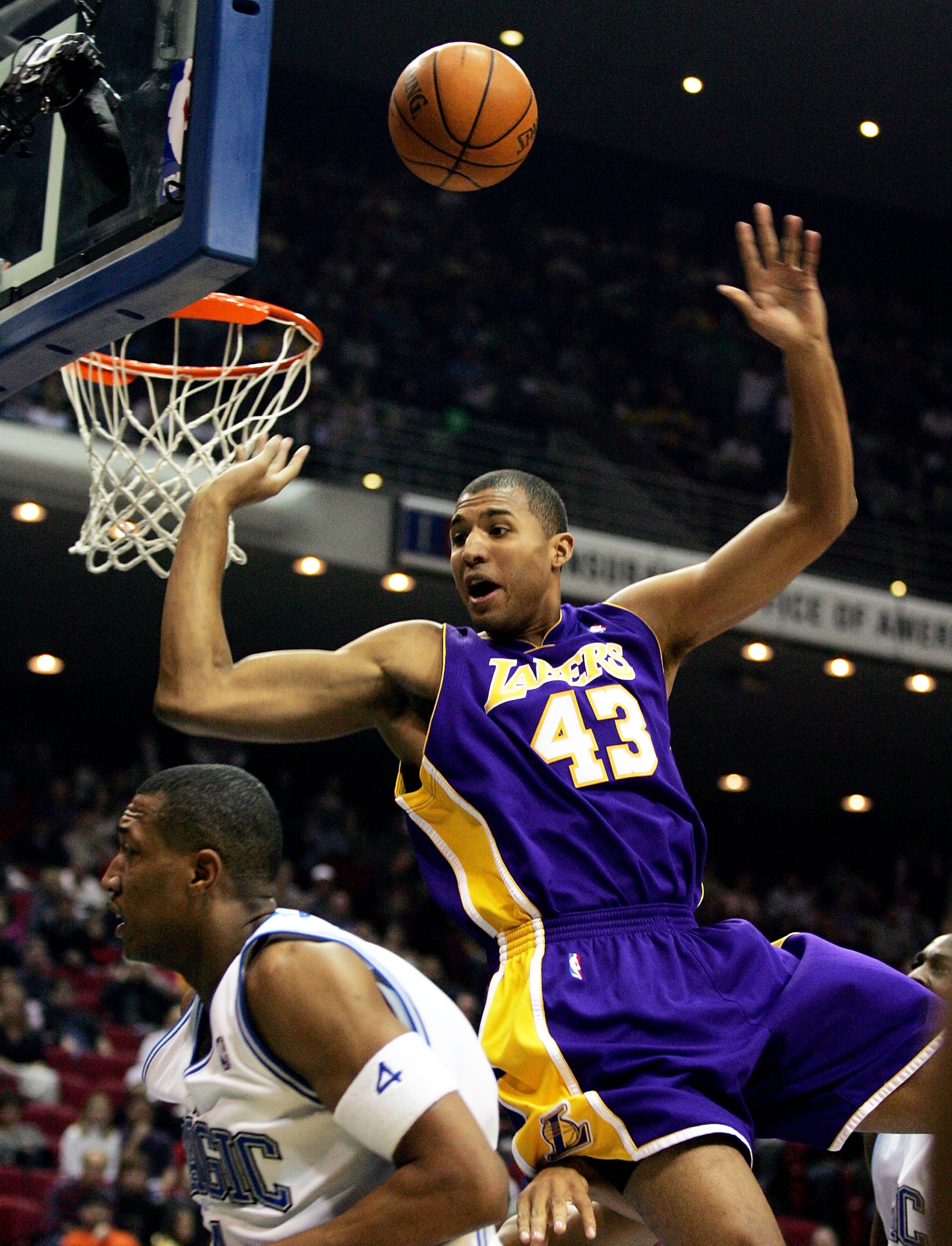 ORLANDO, FL - DECEMBER 23: Brian Cook #43 of the Los Angeles Lakers commits an offensive foul against the Orlando Magic at the TD Waterhouse Centre on December 23, 2005 in Orlando, Florida. NOTE TO USER: User expressly acknowledges and agrees that, by d ORLANDO, FL - DECEMBER 23: Brian Cook #43 of the Los Angeles Lakers commits an offensive foul against the Orlando Magic at the TD Waterhouse Centre on December 23, 2005 in Orlando, Florida. NOTE TO USER: User expressly acknowledges and agrees that, by d
