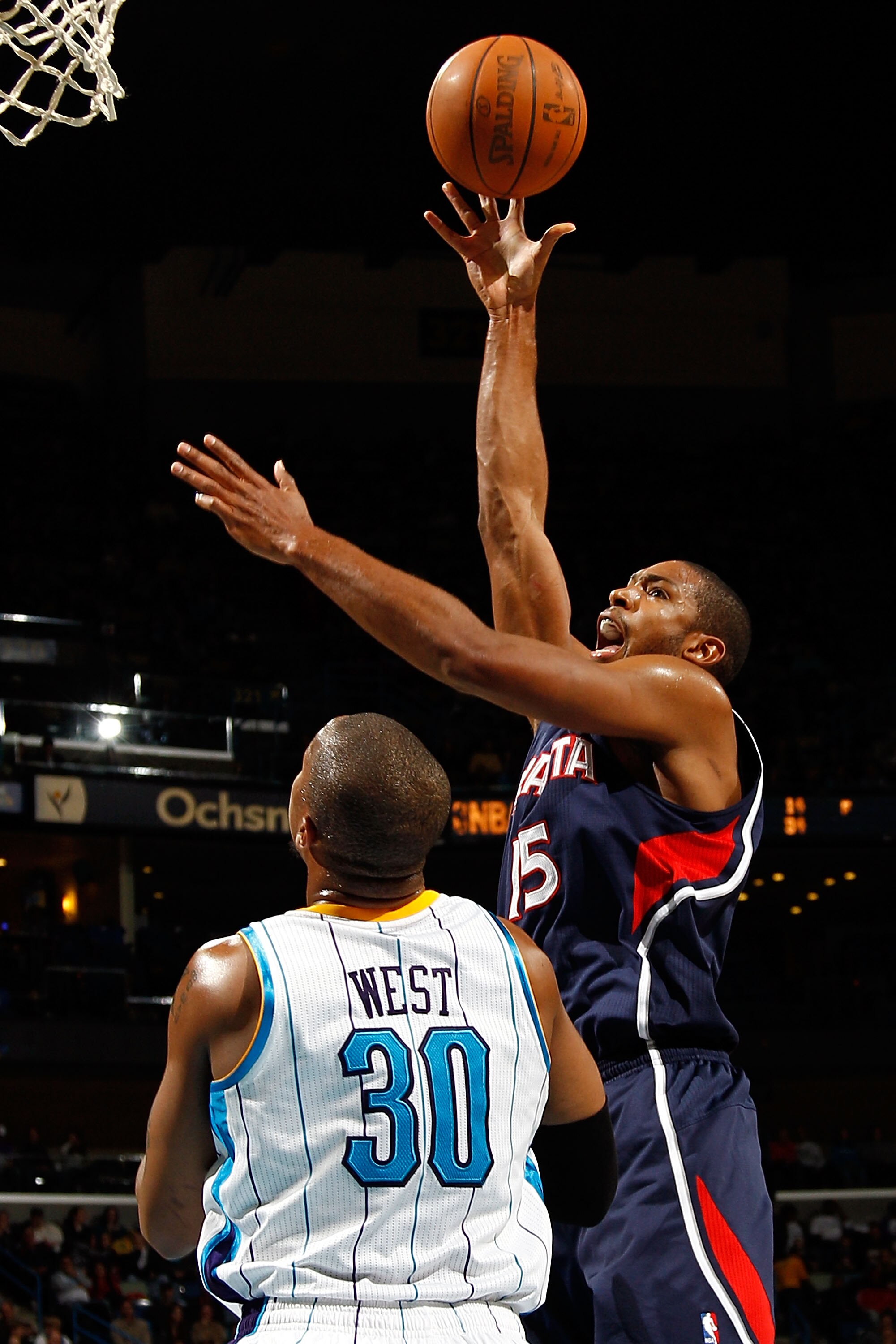NEW ORLEANS, LA - DECEMBER 26:  Al Horford #15 of the Atlanta Hawks shoots the ball over David West #30 of the New Orleans Hornets at the New Orleans Arena on December 26, 2010 in New Orleans, Louisiana.  The Hornets defeated the Hawks 93-86.  NOTE TO USE