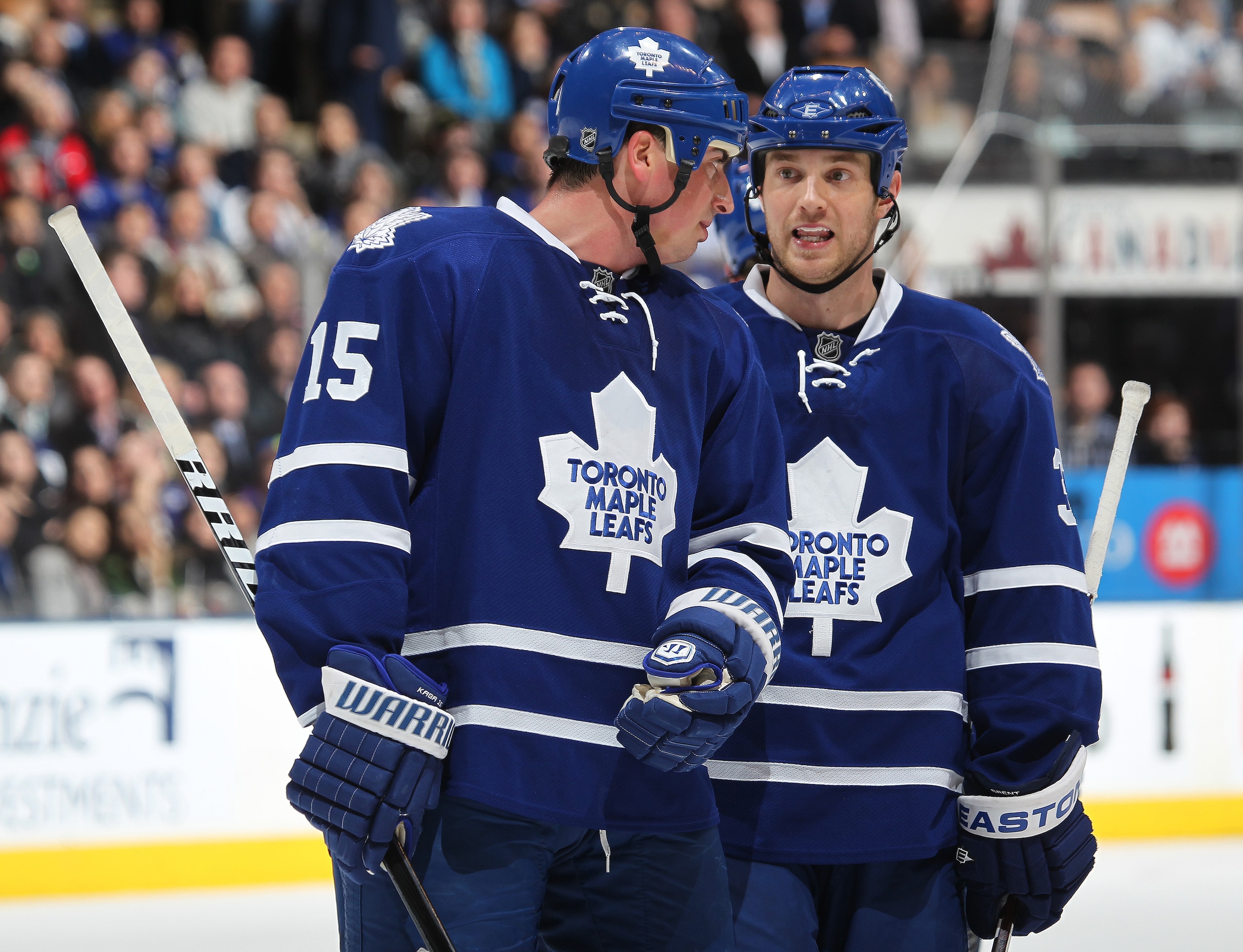 TORONTO, CAN - FEBRUARY 7:  Tim Brent #37 and Tomas Kaberle #15 of the Toronto Maple Leafs chat prior to a faceoff in a game against the Atlanta Thrashers on February 7, 2011 at the Air Canada Centre in Toronto, Canada. The Leafs defeated the Thrashers 5-