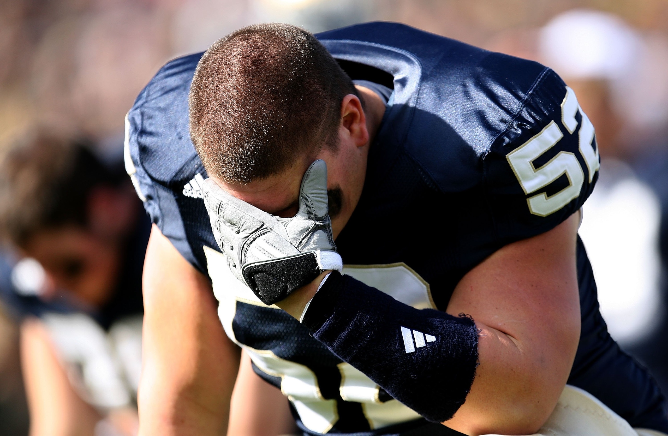 SOUTH BEND, IN - OCTOBER 17: Braxston Cave #52 of the Notre Dame Fighting Irish takes a moment to himself before a game against the USC Trojans at Notre Dame Stadium on October 17, 2009 in South Bend, Indiana. USC defeated Notre Dame 34-27. (Photo by Jona SOUTH BEND, IN - OCTOBER 17: Braxston Cave #52 of the Notre Dame Fighting Irish takes a moment to himself before a game against the USC Trojans at Notre Dame Stadium on October 17, 2009 in South Bend, Indiana. USC defeated Notre Dame 34-27. (Photo by Jona