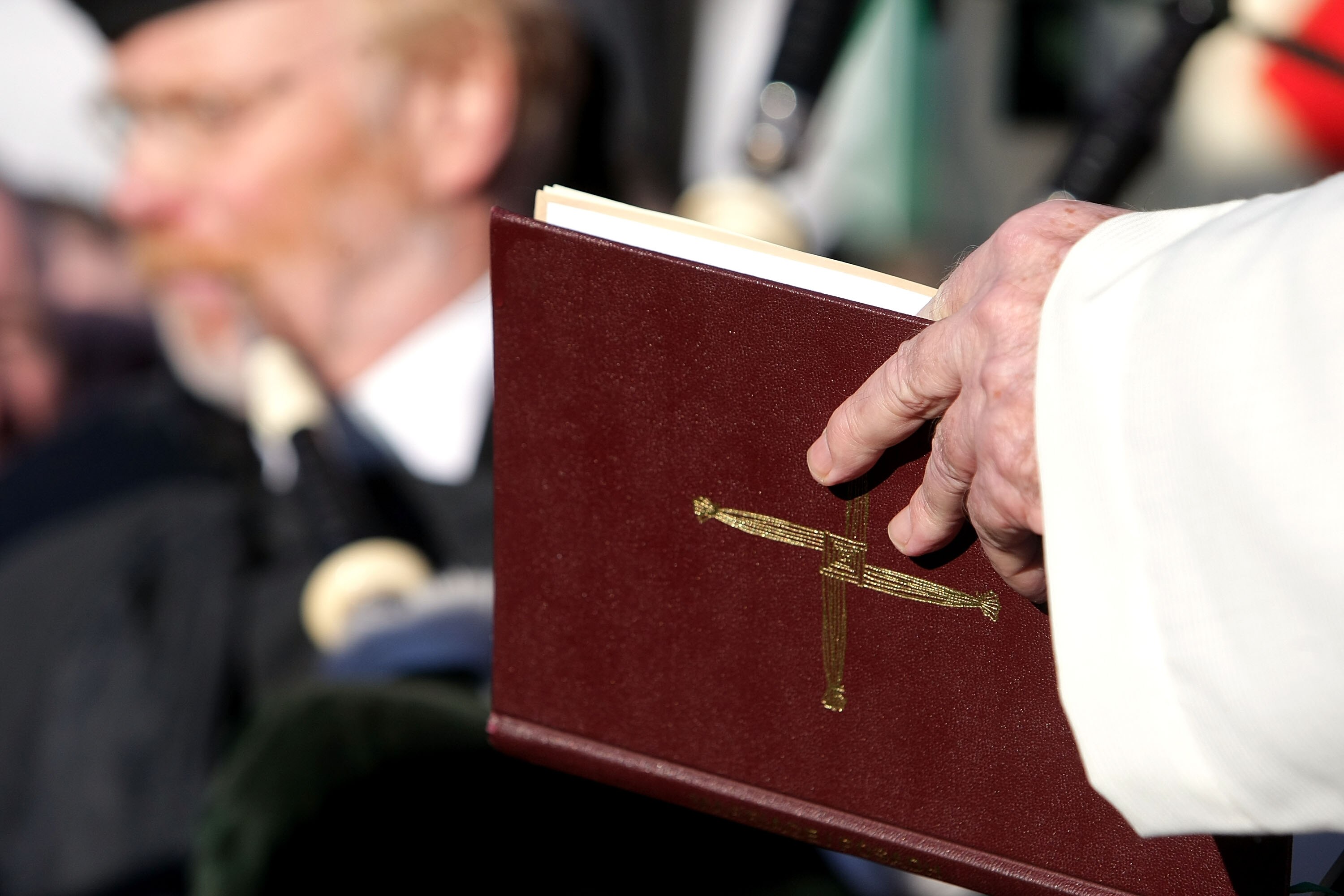 MUNICH, GERMANY - FEBRUARY 05:  A priest reads out of bible during the 50th anniversary to commerate the Munich air disaster on February 6, 2008 in Kirchtrudering , Germany. 23 people died in an airplane crash at Munich Airport 50 years ago. Eight Manches
