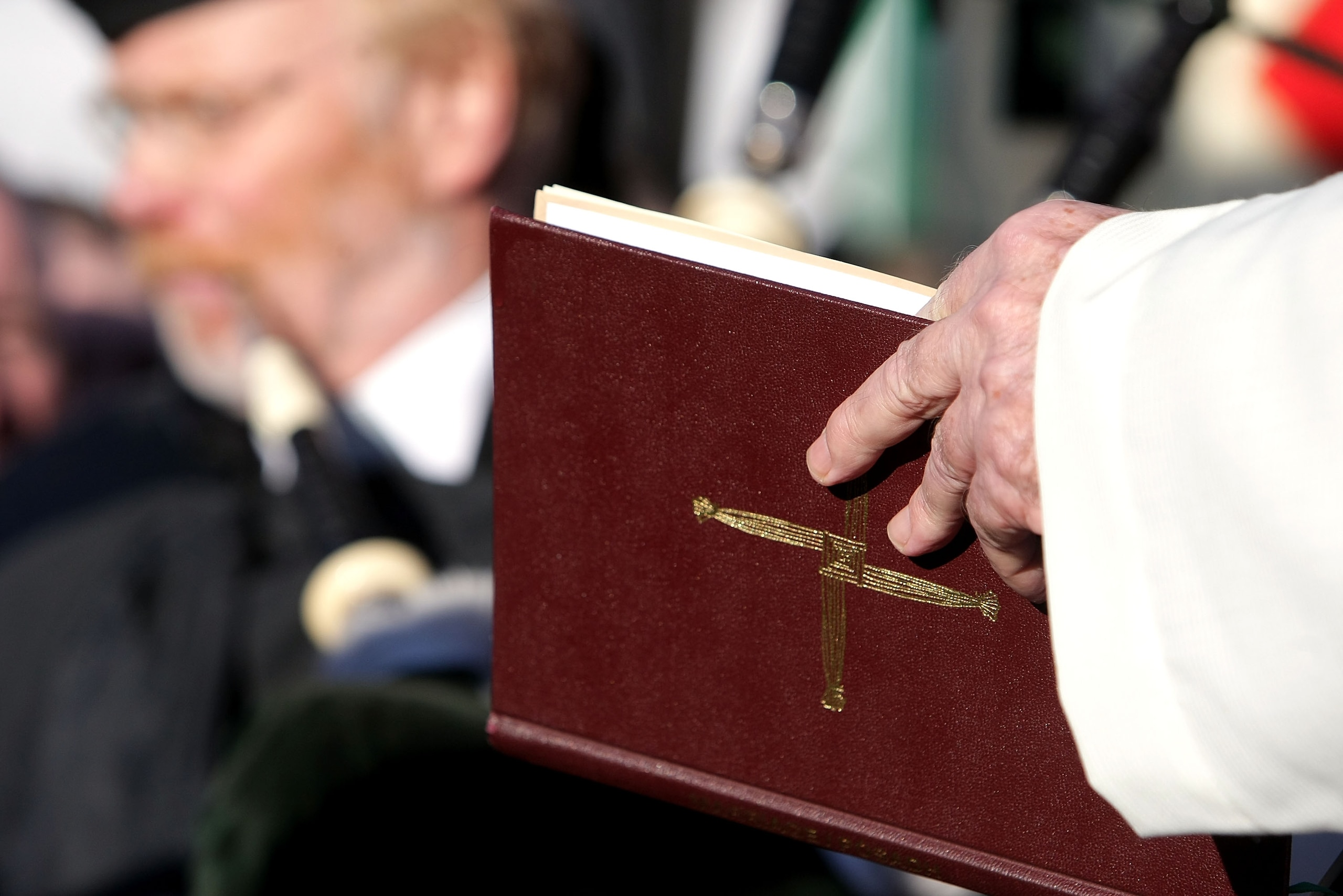 MUNICH, GERMANY - FEBRUARY 05: A priest reads out of bible during the 50th anniversary to commerate the Munich air disaster on February 6, 2008 in Kirchtrudering , Germany. 23 people died in an airplane crash at Munich Airport 50 years ago. Eight Manches MUNICH, GERMANY - FEBRUARY 05: A priest reads out of bible during the 50th anniversary to commerate the Munich air disaster on February 6, 2008 in Kirchtrudering , Germany. 23 people died in an airplane crash at Munich Airport 50 years ago. Eight Manches