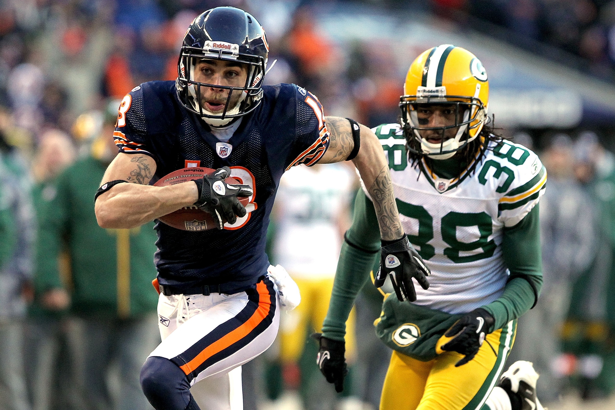 CHICAGO, IL - JANUARY 23: Johnny Knox #13 of the Chicago Bears runs ahead of Tramon Williams #38 of the Green Bay Packers for a 32-yard gain in the fourth quarter in the NFC Championship Game at Soldier Field on January 23, 2011 in Chicago, Illinois. (P CHICAGO, IL - JANUARY 23: Johnny Knox #13 of the Chicago Bears runs ahead of Tramon Williams #38 of the Green Bay Packers for a 32-yard gain in the fourth quarter in the NFC Championship Game at Soldier Field on January 23, 2011 in Chicago, Illinois. (P