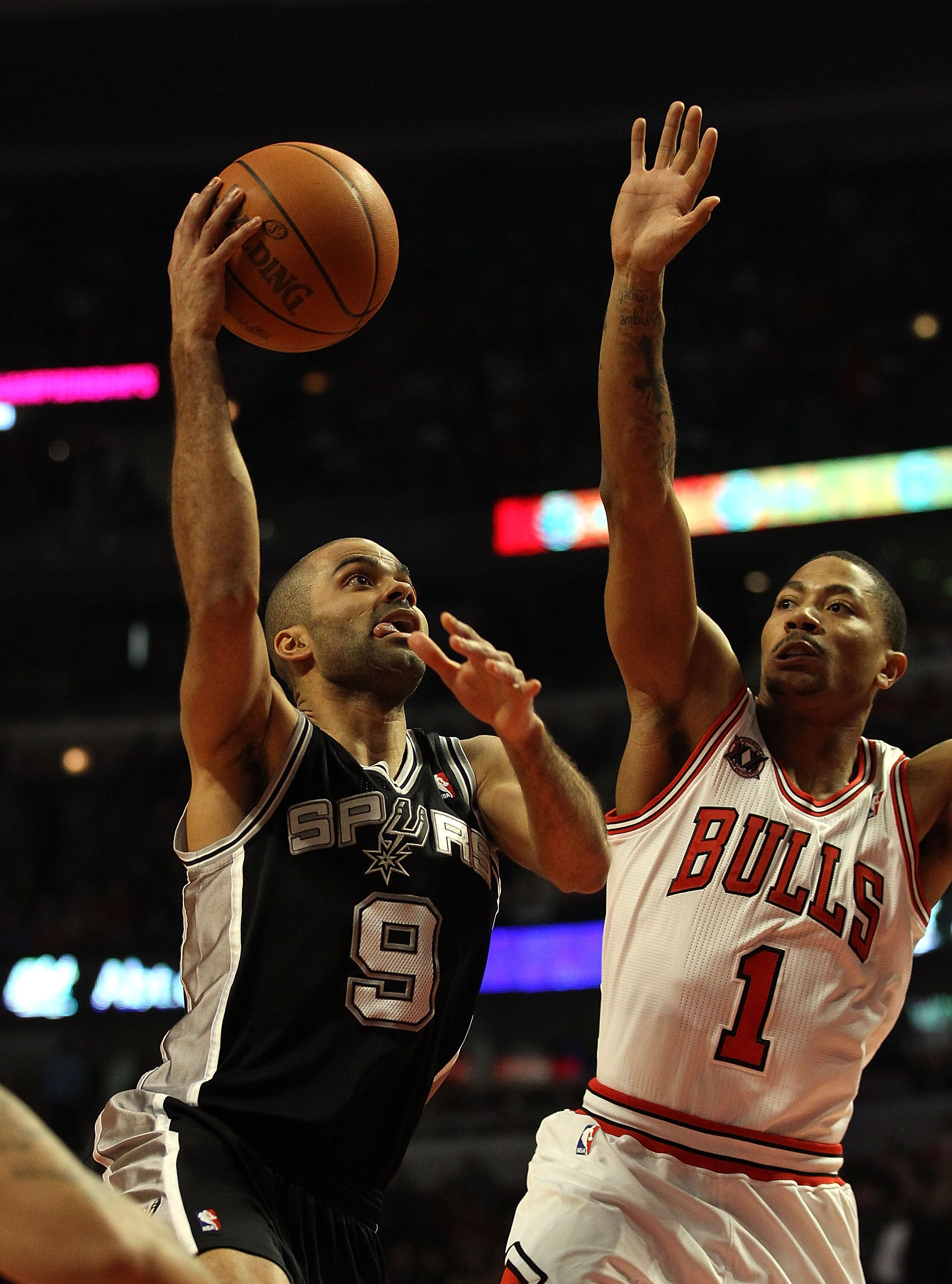 CHICAGO, IL - FEBRUARY 17: Tony Parker #9 of the San Antonio Spurs goes up for a shot against Derrick Rose #1 of the Chicago Bulls at the United Center on February 17, 2011 in Chicago, Illinois. NOTE TO USER: User expressly acknowledges and agrees that, b