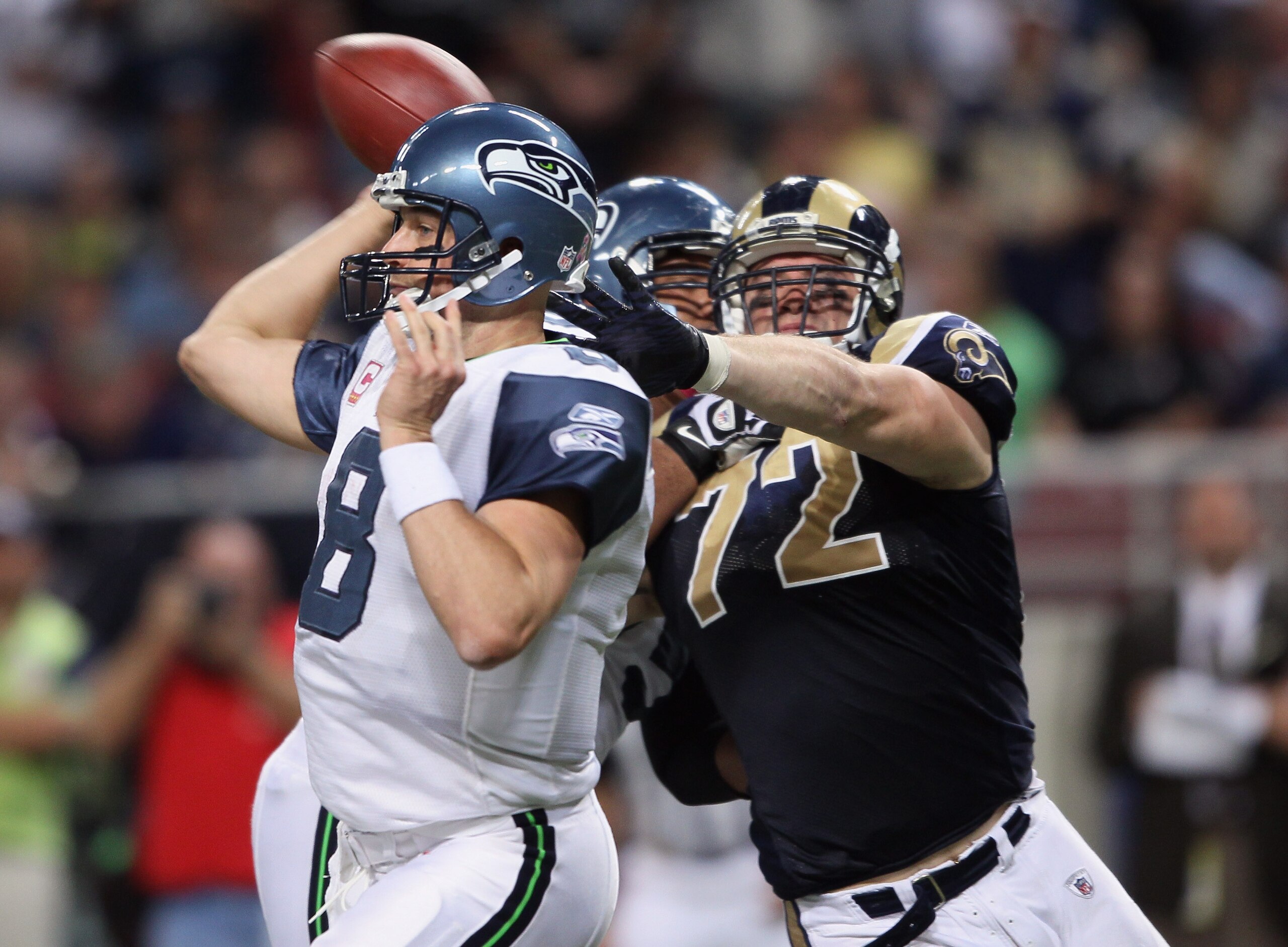 ST. LOUIS - OCTOBER 03: Chris Long #72 of the St. Louis Rams pressures Matt Hasselbeck #8 of the Seattle Seahawks on October 3, 2010 at Edward Jones Dome in St. Louis, Missouri. The Rams defeated the Seahawks 20-3. (Photo by Elsa/Getty Images) ST. LOUIS - OCTOBER 03: Chris Long #72 of the St. Louis Rams pressures Matt Hasselbeck #8 of the Seattle Seahawks on October 3, 2010 at Edward Jones Dome in St. Louis, Missouri. The Rams defeated the Seahawks 20-3. (Photo by Elsa/Getty Images)