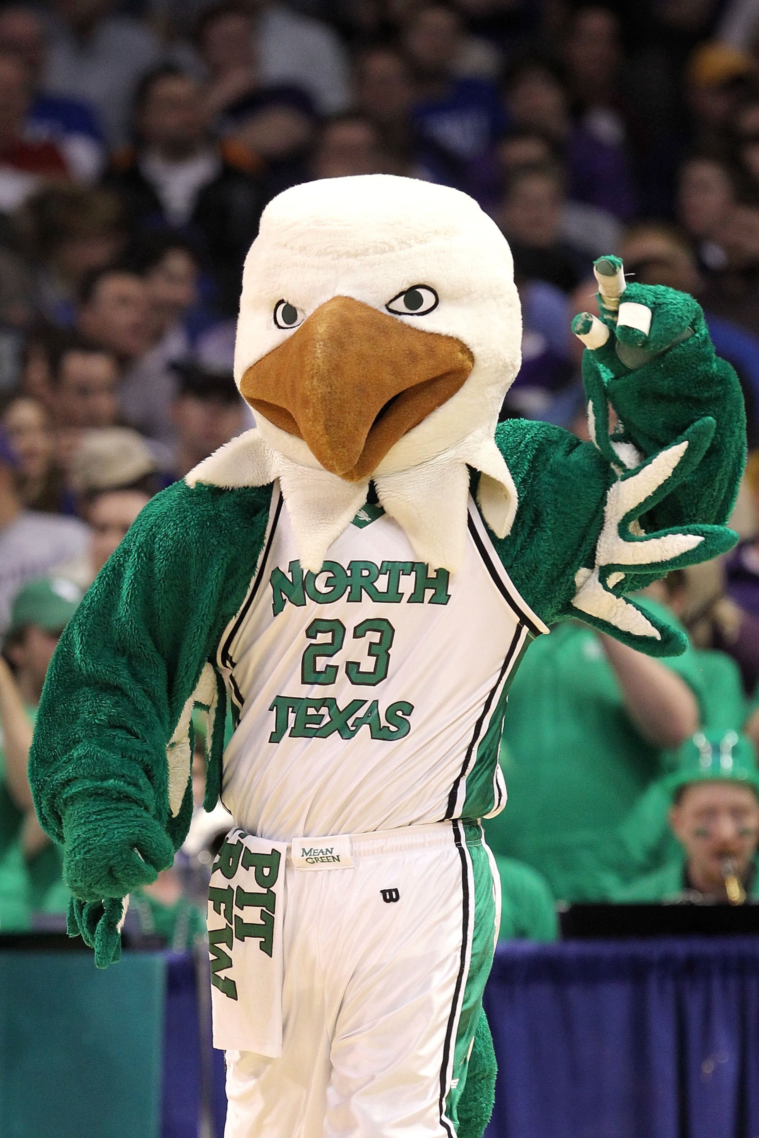 OKLAHOMA CITY - MARCH 18: Scrappy the mascot for the North Texas Mean Green performs against the Kansas State Wildcats during the first round of the 2010 NCAA men's basketball tournament at Ford Center on March 18, 2010 in Oklahoma City, Oklahoma. (Phot OKLAHOMA CITY - MARCH 18: Scrappy the mascot for the North Texas Mean Green performs against the Kansas State Wildcats during the first round of the 2010 NCAA men's basketball tournament at Ford Center on March 18, 2010 in Oklahoma City, Oklahoma. (Phot