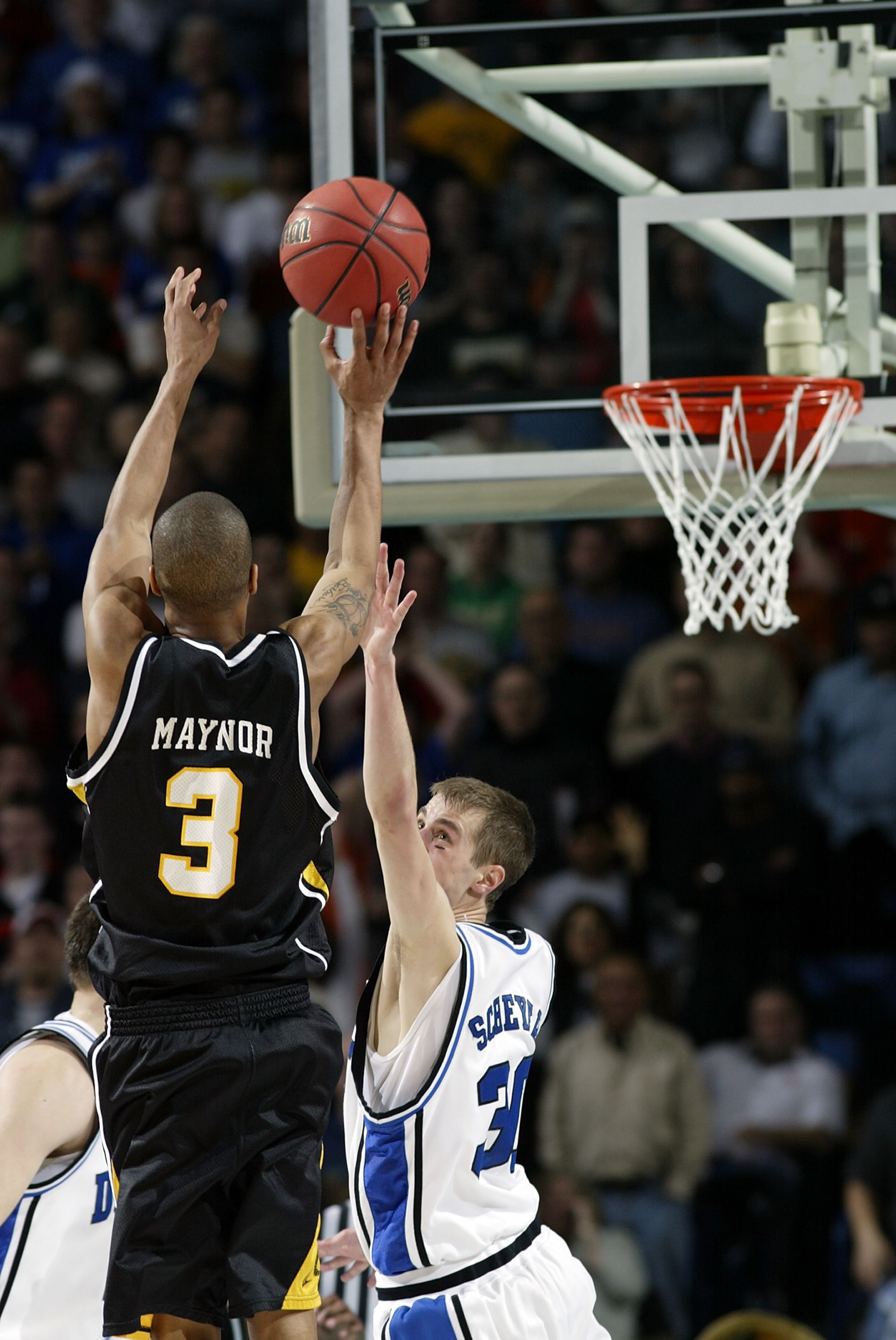 BUFFALO, NY - MARCH 15:  Eric Maynor #3 of the Virginia Commonwealth Rams shoots the game winning shot over Jon Scheyer #30 of the Duke Blue Devils during round one of the NCAA Men's Basketball Tournament at the HSBC Arena on March 15, 2007  in Buffalo, N