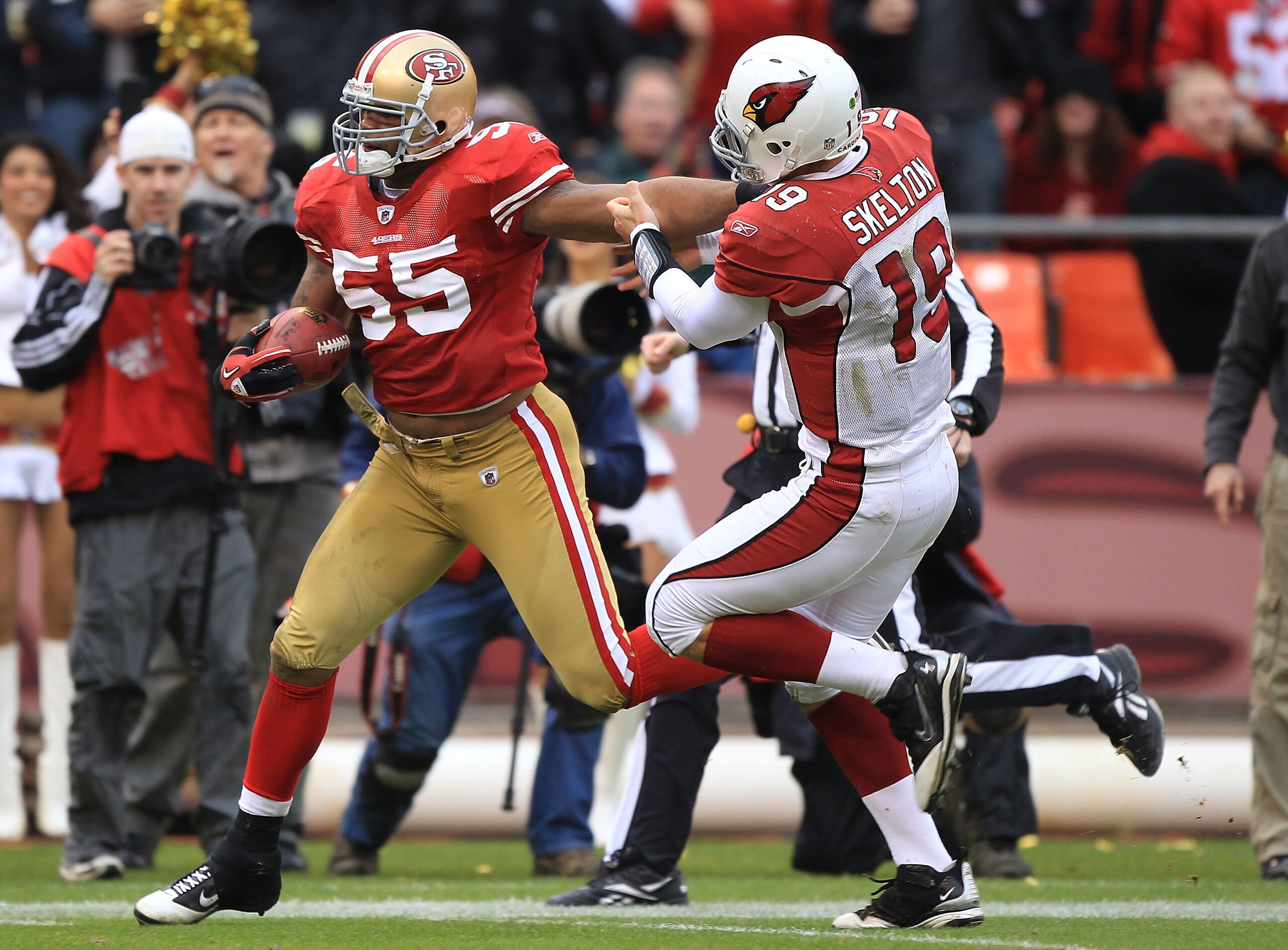 SAN FRANCISCO, CA - JANUARY 2:  Ahamd Brooks #55 of the San Francisco 49ers runs an interception back against John Skelton #19 of the Arizona Cardinals during an NFL game at Candlestick Park on January 2, 2011 in San Francisco, California.(Photo by Jed Ja