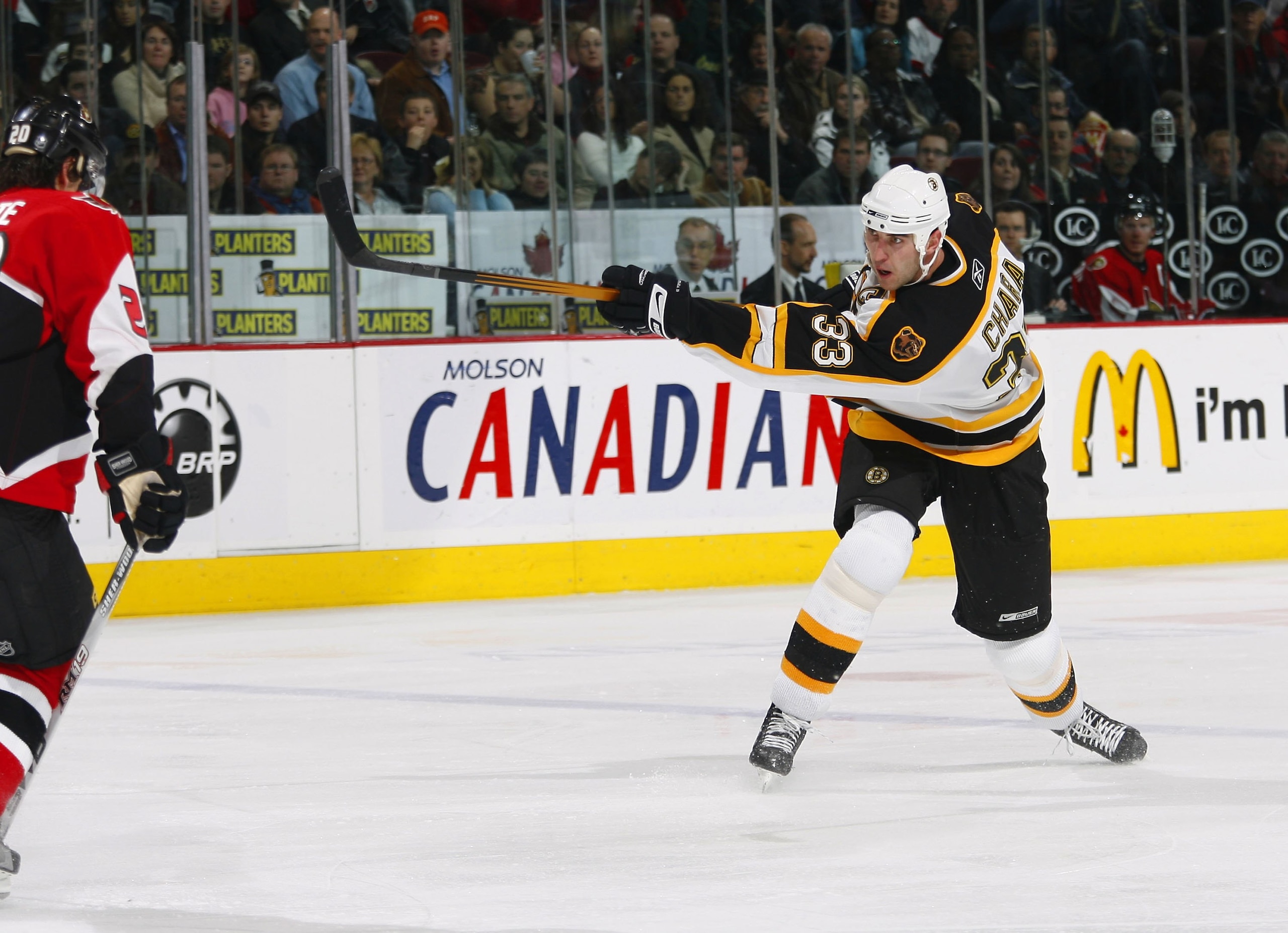 OTTAWA, CANADA - DECEMBER 19: Zdeno Chara #33 of the Boston Bruins fires a slap shot from the point during a powerplay against the Ottawa Senators in the second period of a game on December 19, 2006 at the Scotiabank Place in Ottawa, Canada. The Bruins OTTAWA, CANADA - DECEMBER 19: Zdeno Chara #33 of the Boston Bruins fires a slap shot from the point during a powerplay against the Ottawa Senators in the second period of a game on December 19, 2006 at the Scotiabank Place in Ottawa, Canada. The Bruins