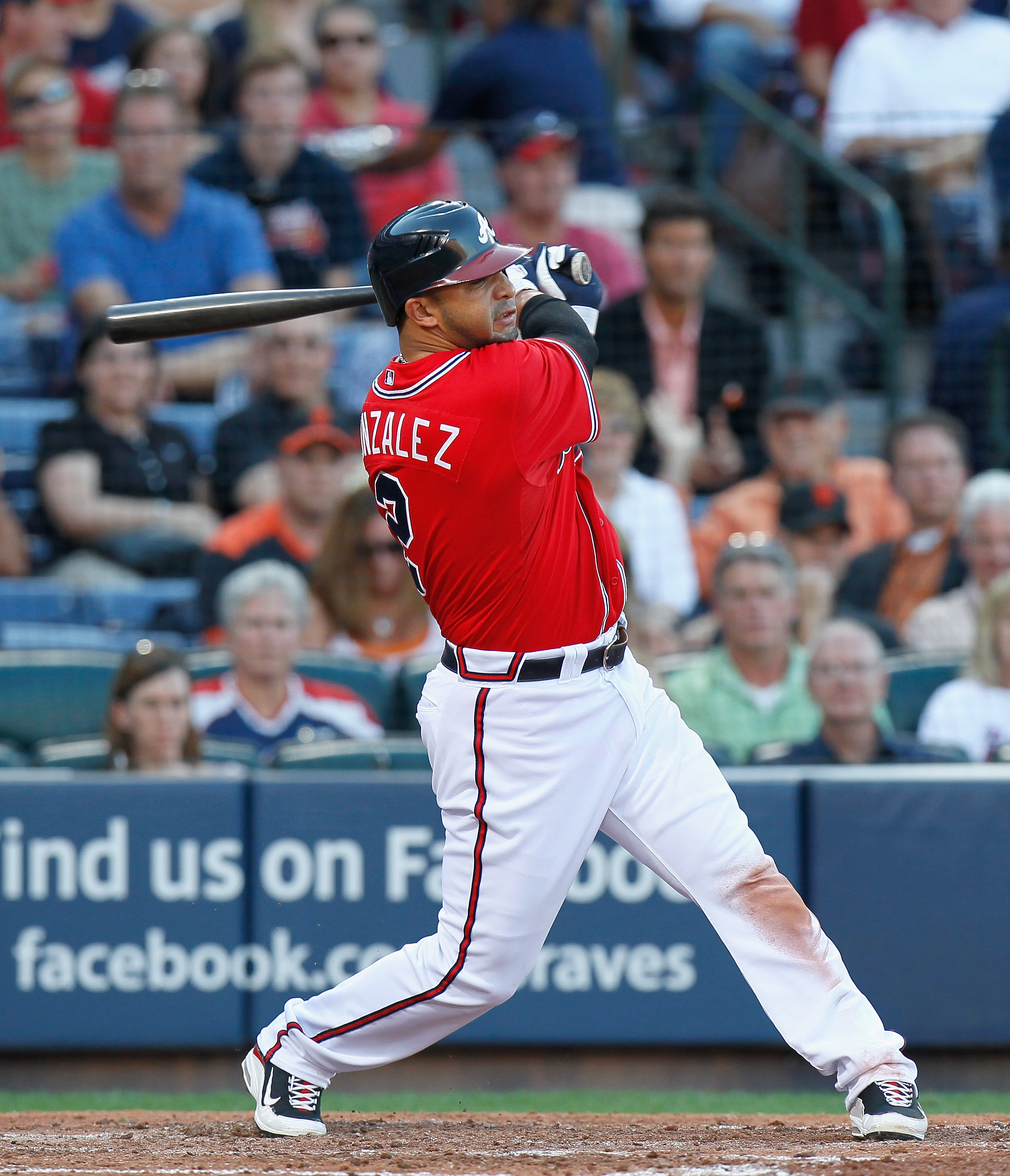 Atlanta Braves' Dan Uggla, right, bangs forearms with Chipper