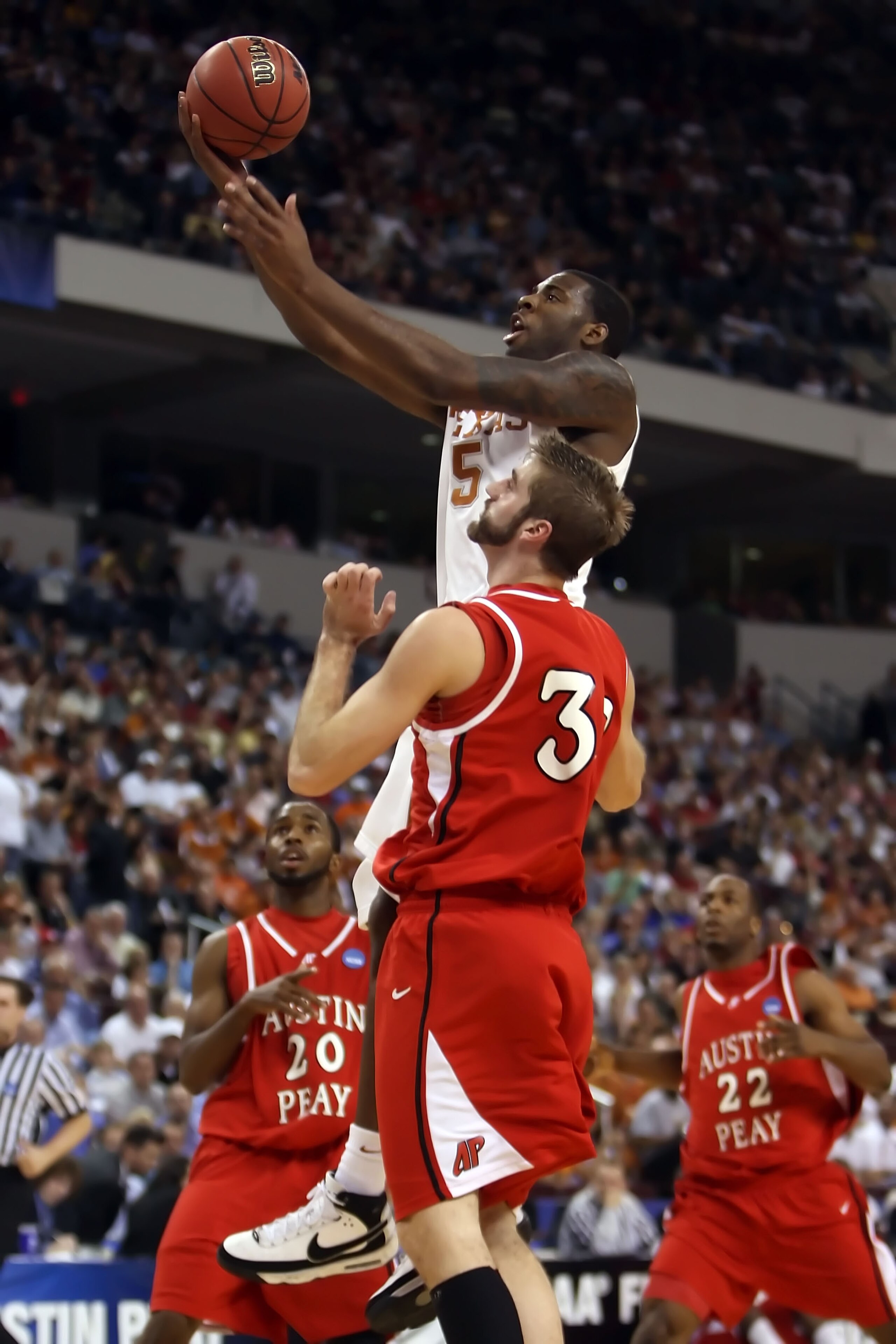NORTH LITTLE ROCK, AR - MARCH 21:  Damion James #5 of the Texas Longhorns goes up for a shot against Todd Babinton #32 of the Austin Peay Governors during the first round of the South Regional as part of the 2008 NCAA Men's Basketball Tournament at Alltel